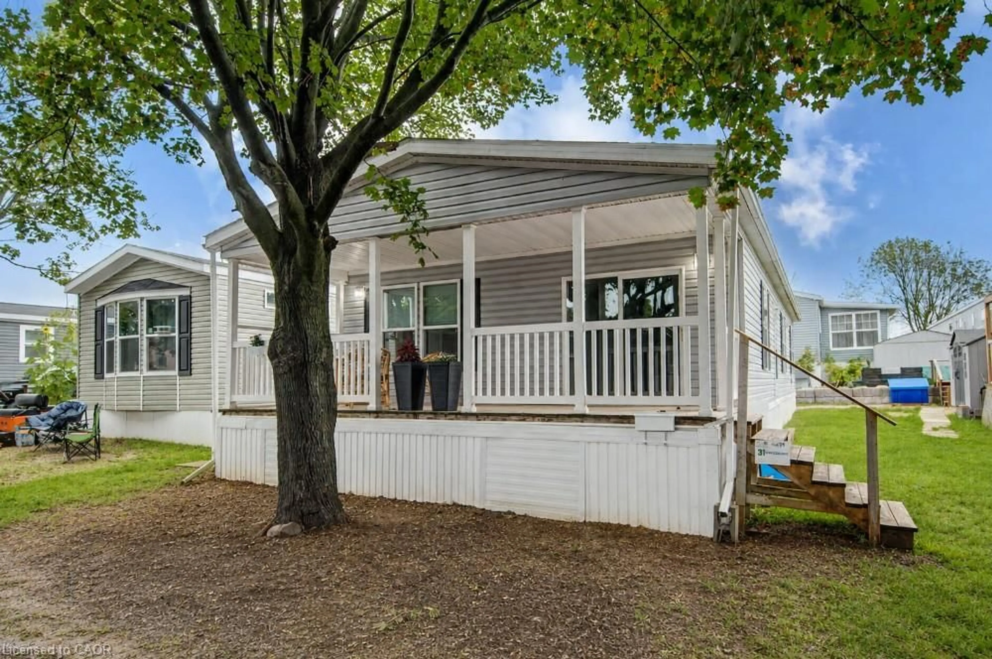 Home with vinyl exterior material, street for 99 Fourth Concession Rd #431, Burford Ontario N0E 1A0