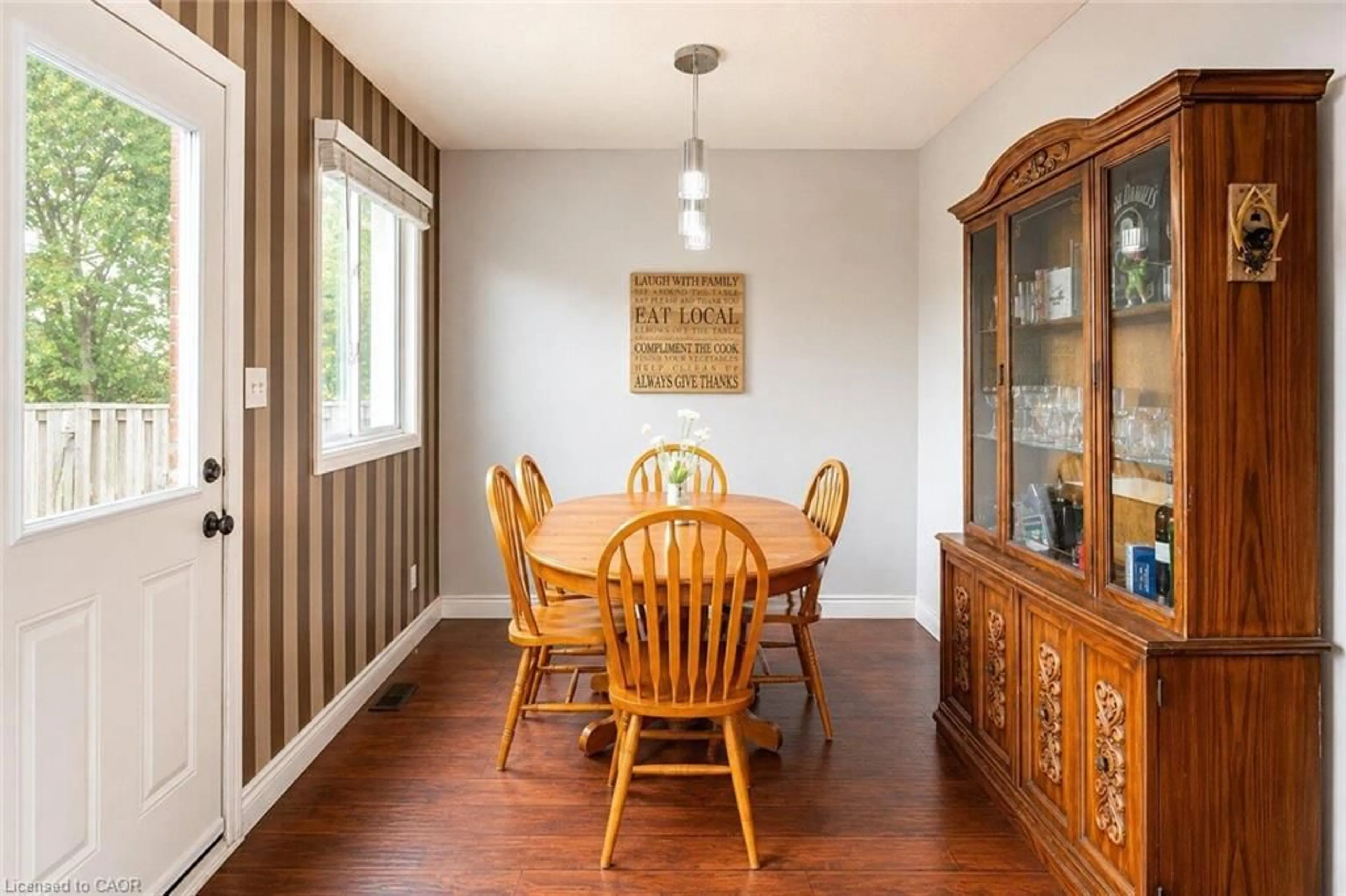 Dining room, wood/laminate floor for 899 Stone Church Rd #1, Hamilton Ontario L8W 1B2
