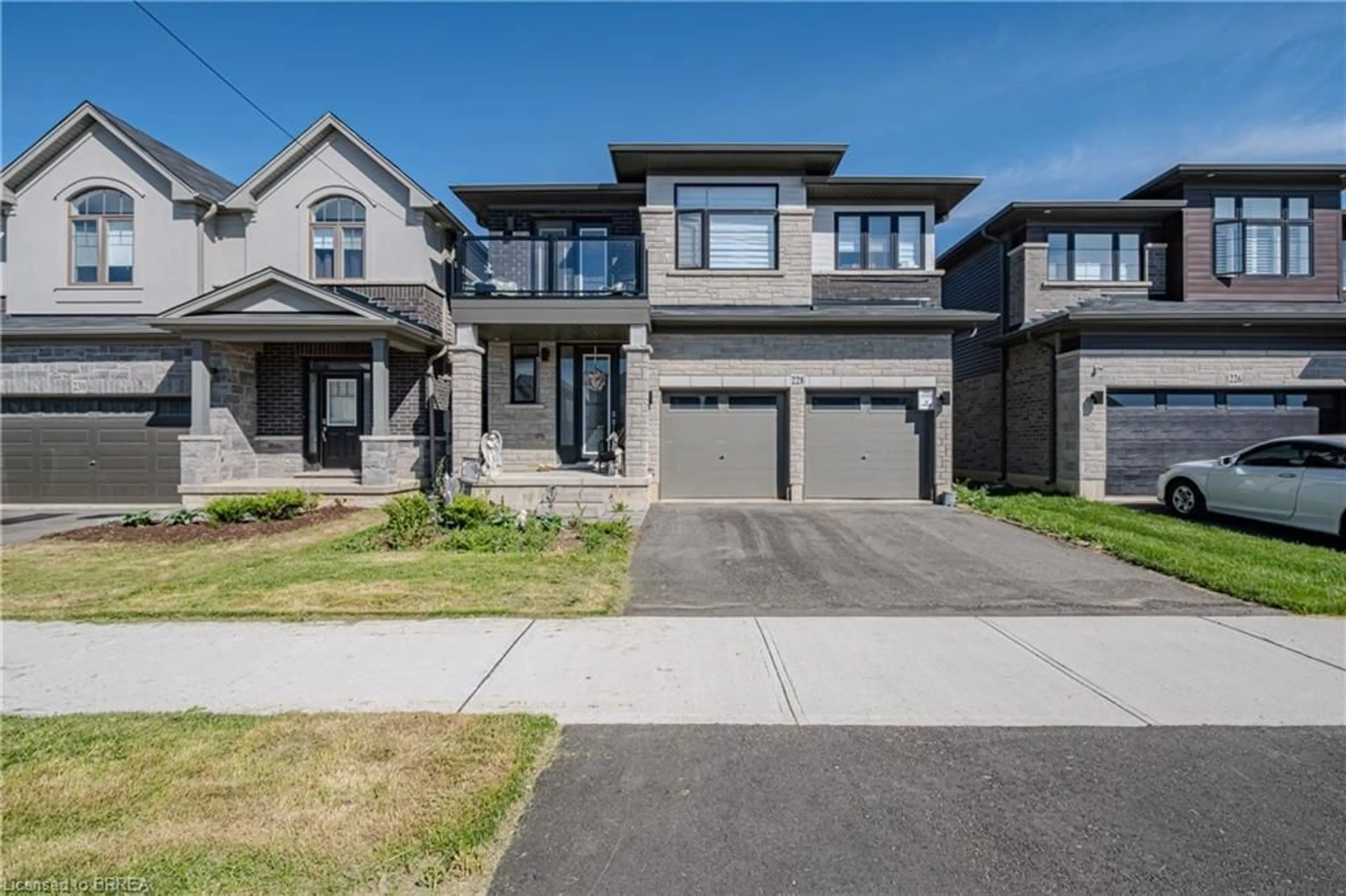 Home with brick exterior material, street for 228 Longboat Run, Brantford Ontario N3T 0X1
