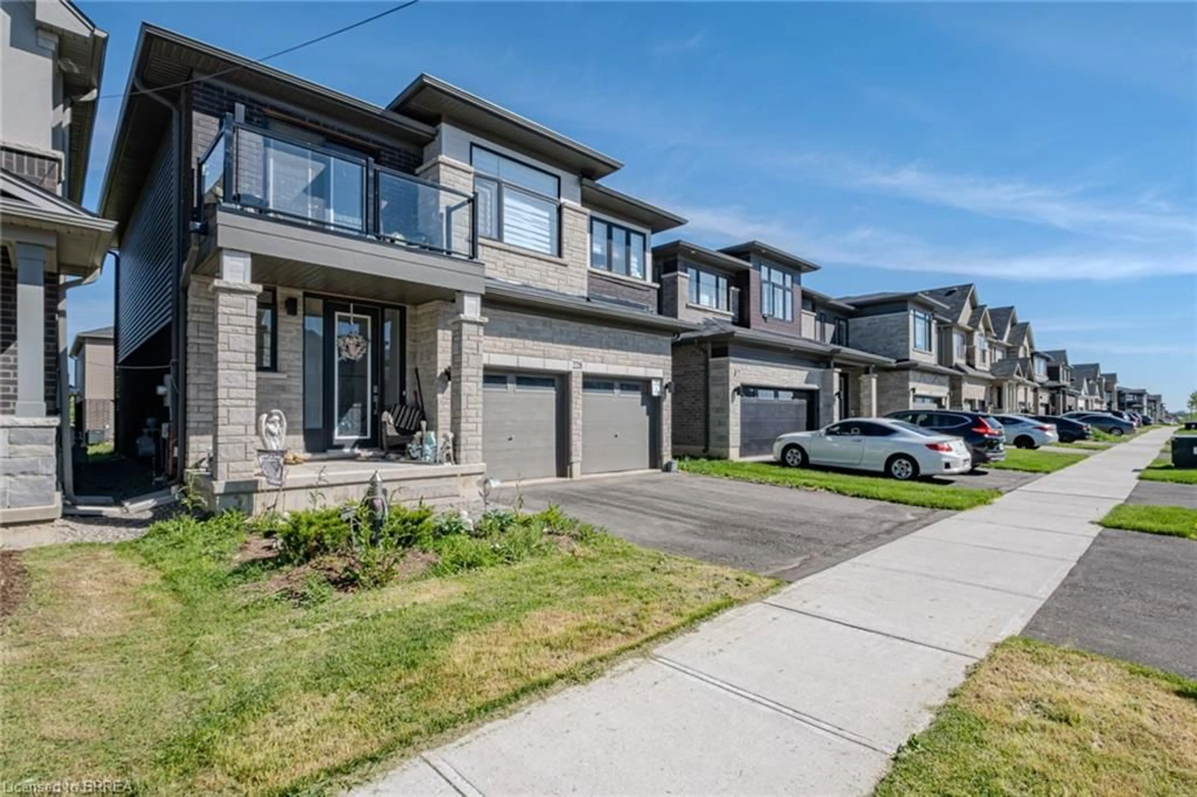 Home with brick exterior material, street for 228 Longboat Run, Brantford Ontario N3T 0X1