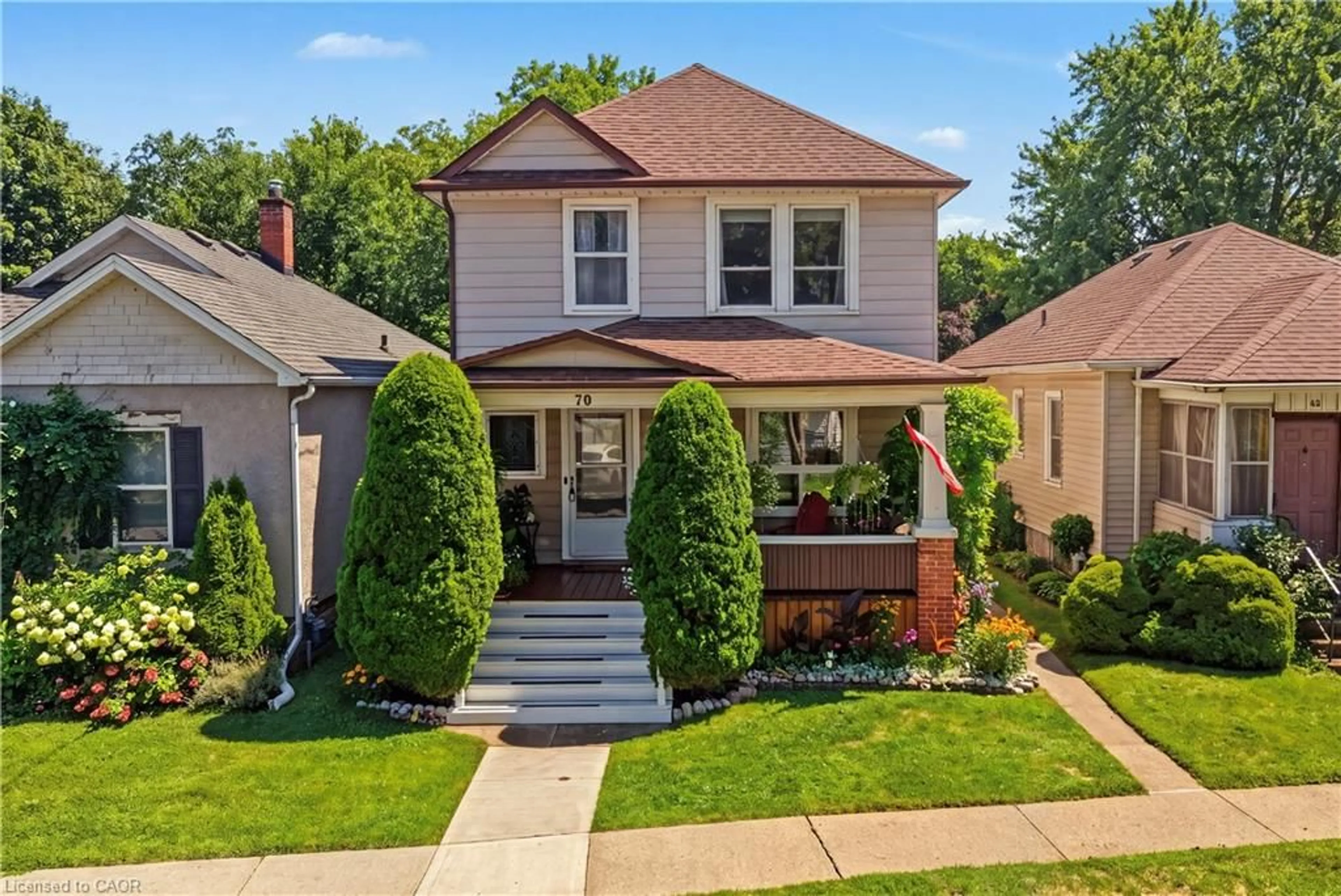 Home with brick exterior material, street for 70 Woodland Ave, St. Catharines Ontario L2R 5A3
