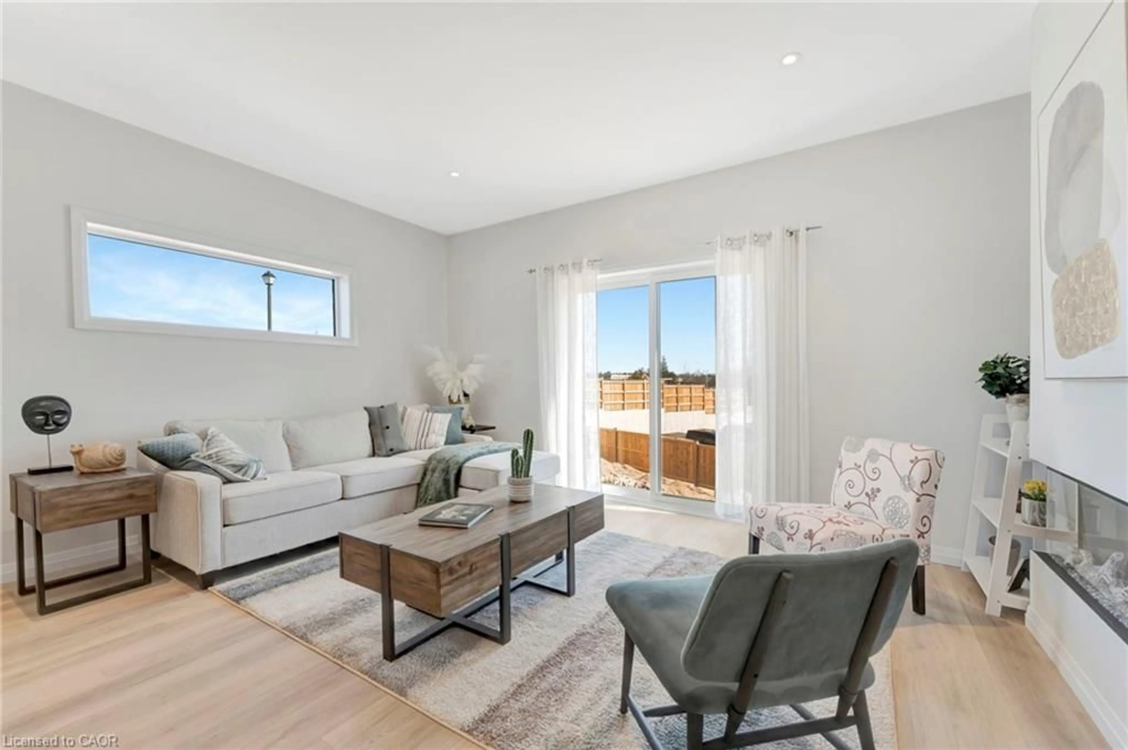 Living room with furniture, wood/laminate floor for 58 Robins Pl, Simcoe Ontario N3Y 0E3