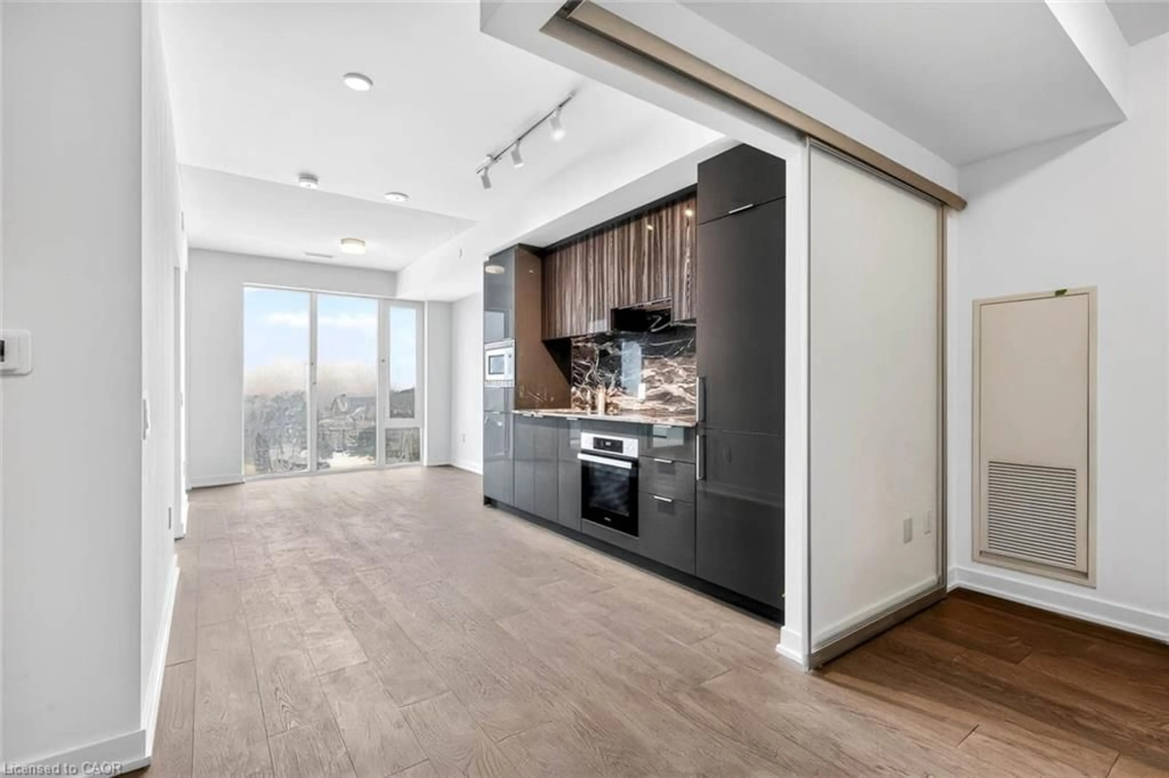 Open concept kitchen, wood/laminate floor for 20 O'neill Rd #536, North York Ontario M3C 3M9