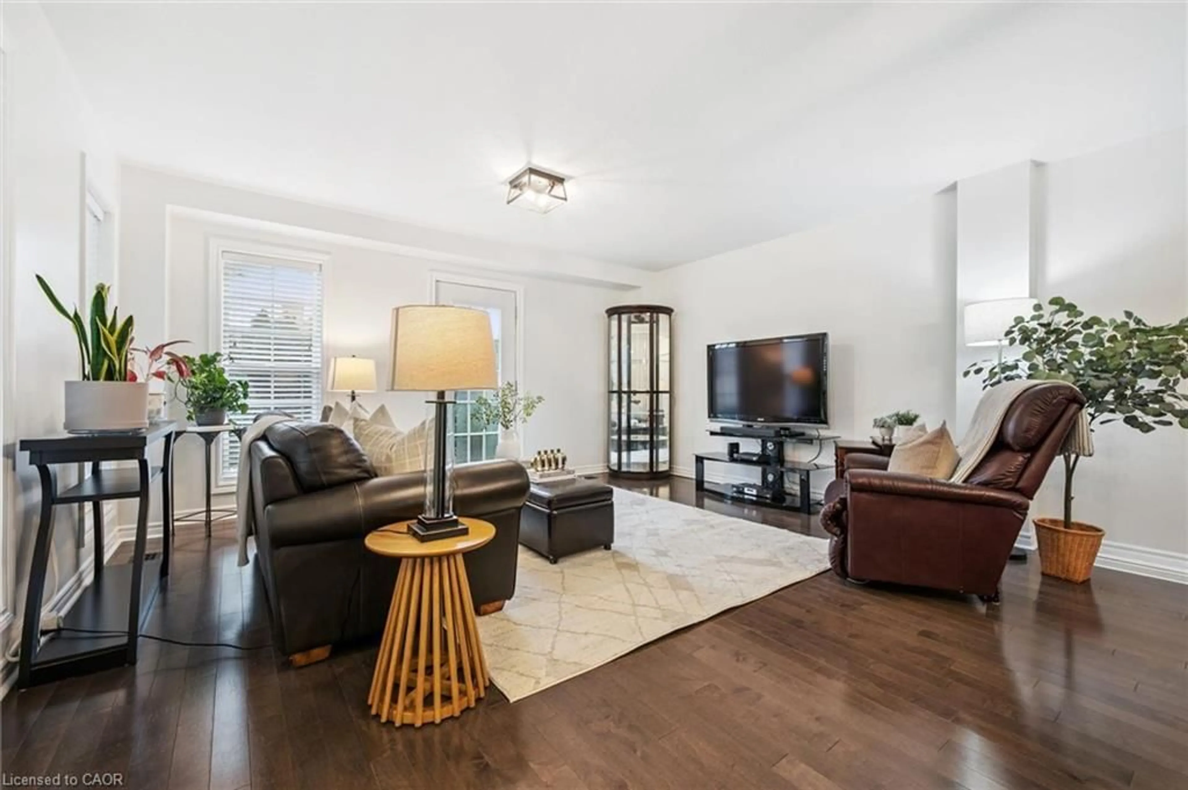Living room with furniture, wood/laminate floor for 100 Frederick Dr #9, Guelph Ontario N1L 0H6