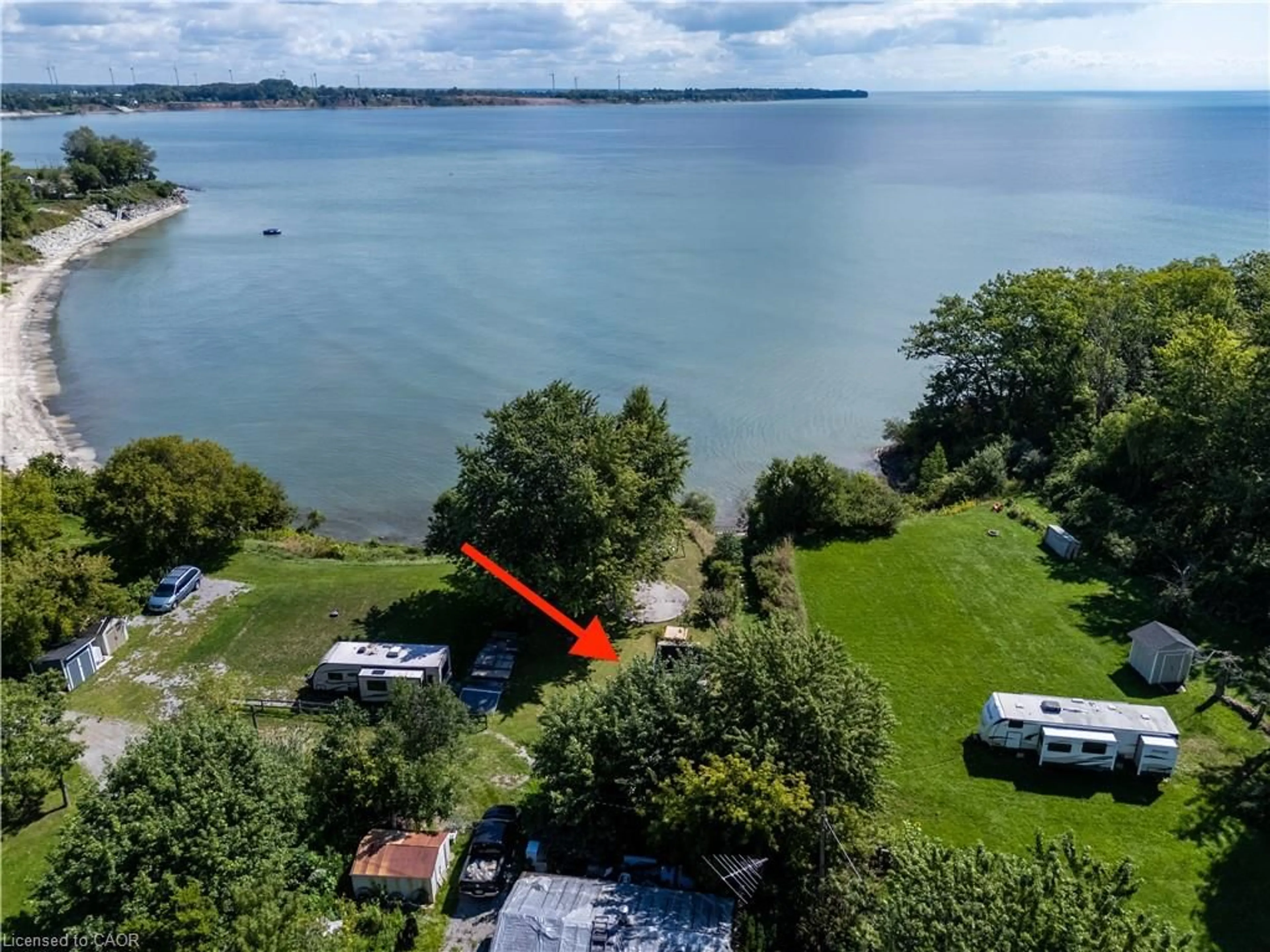A pic from outside/outdoor area/front of a property/back of a property/a pic from drone, water/lake/river/ocean view for 38 Burton Line, Lowbanks Ontario N0A 1K0