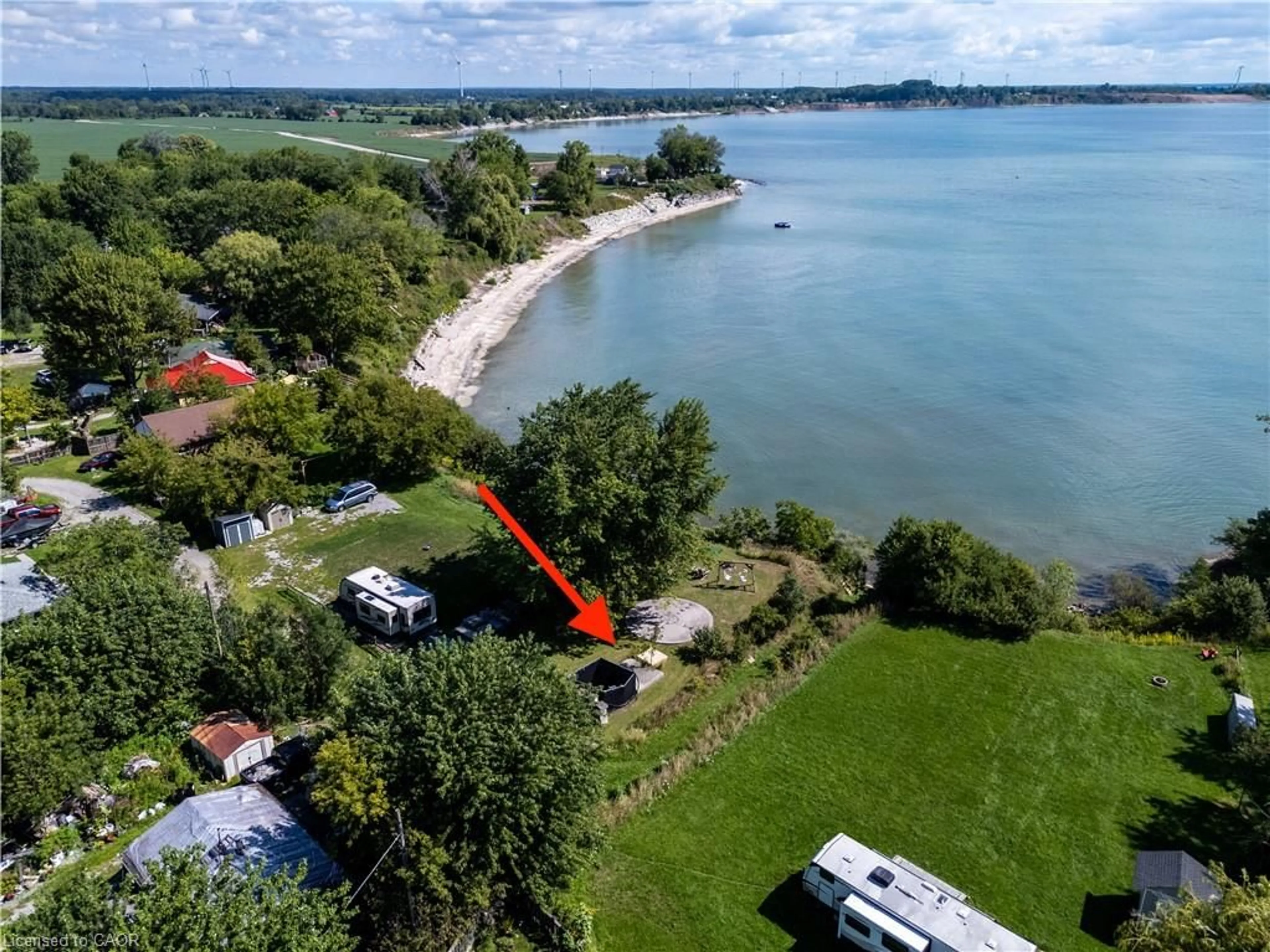 A pic from outside/outdoor area/front of a property/back of a property/a pic from drone, water/lake/river/ocean view for 38 Burton Line, Lowbanks Ontario N0A 1K0
