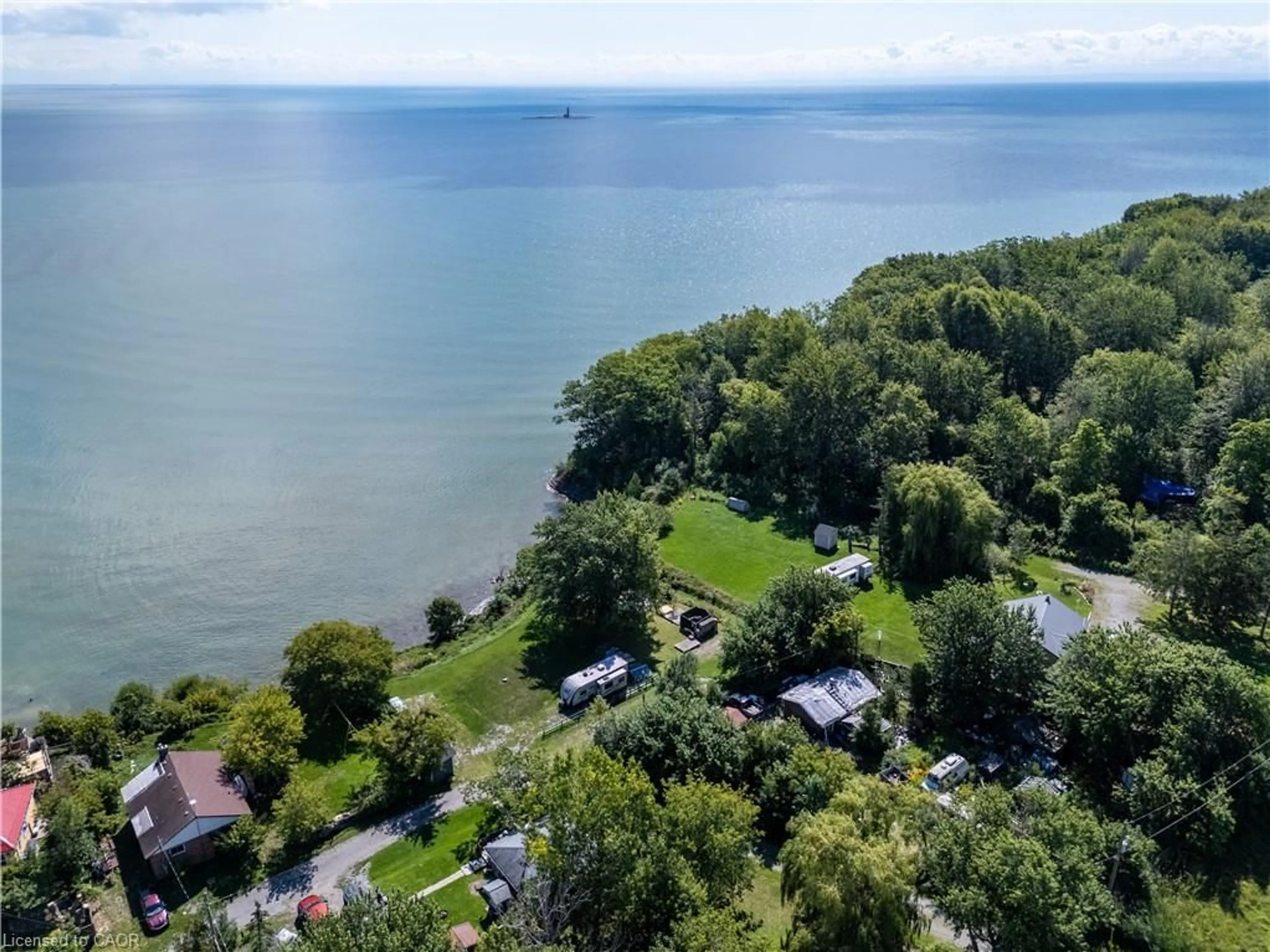 A pic from outside/outdoor area/front of a property/back of a property/a pic from drone, water/lake/river/ocean view for 38 Burton Line, Lowbanks Ontario N0A 1K0