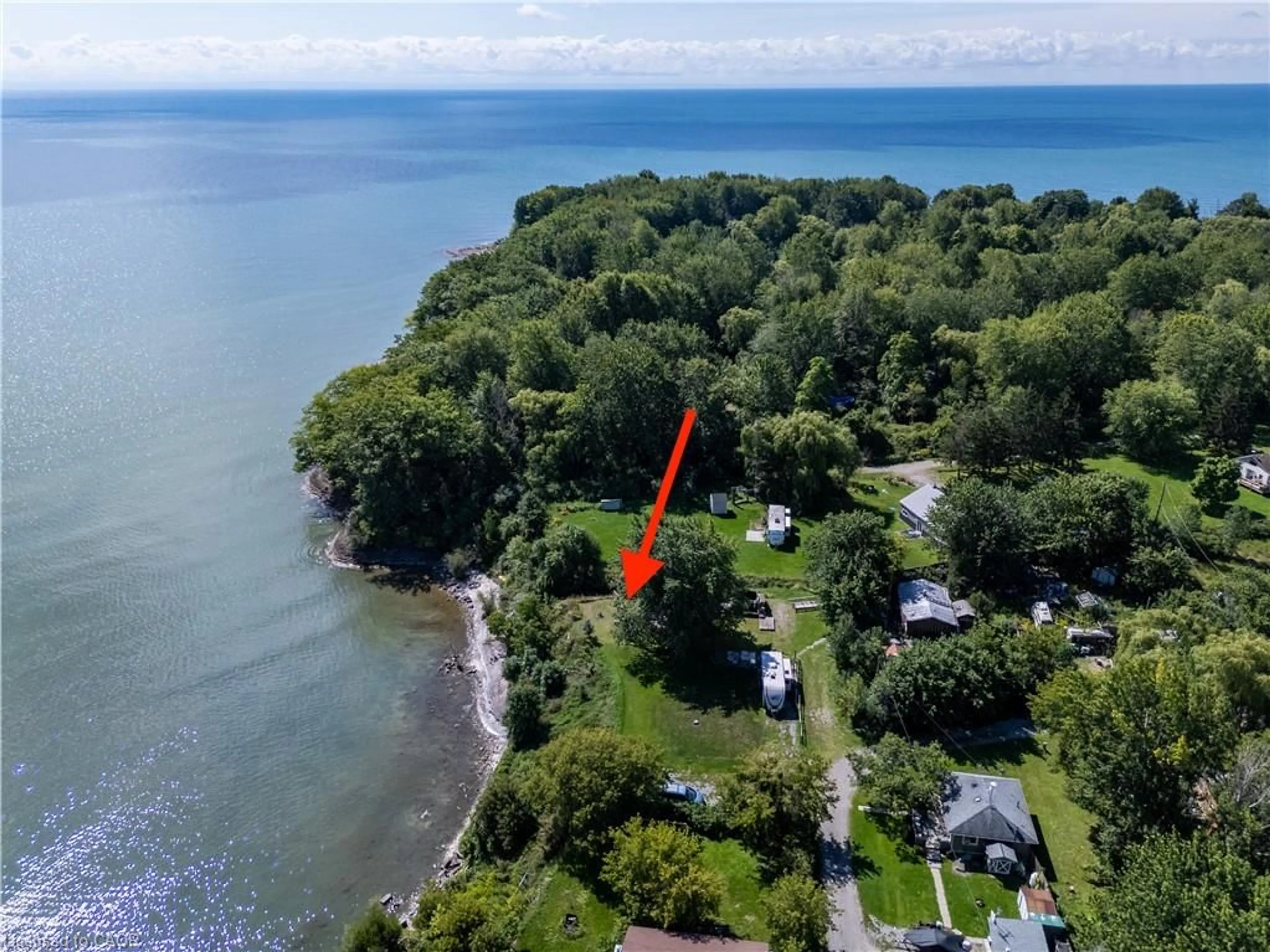 A pic from outside/outdoor area/front of a property/back of a property/a pic from drone, water/lake/river/ocean view for 38 Burton Line, Lowbanks Ontario N0A 1K0