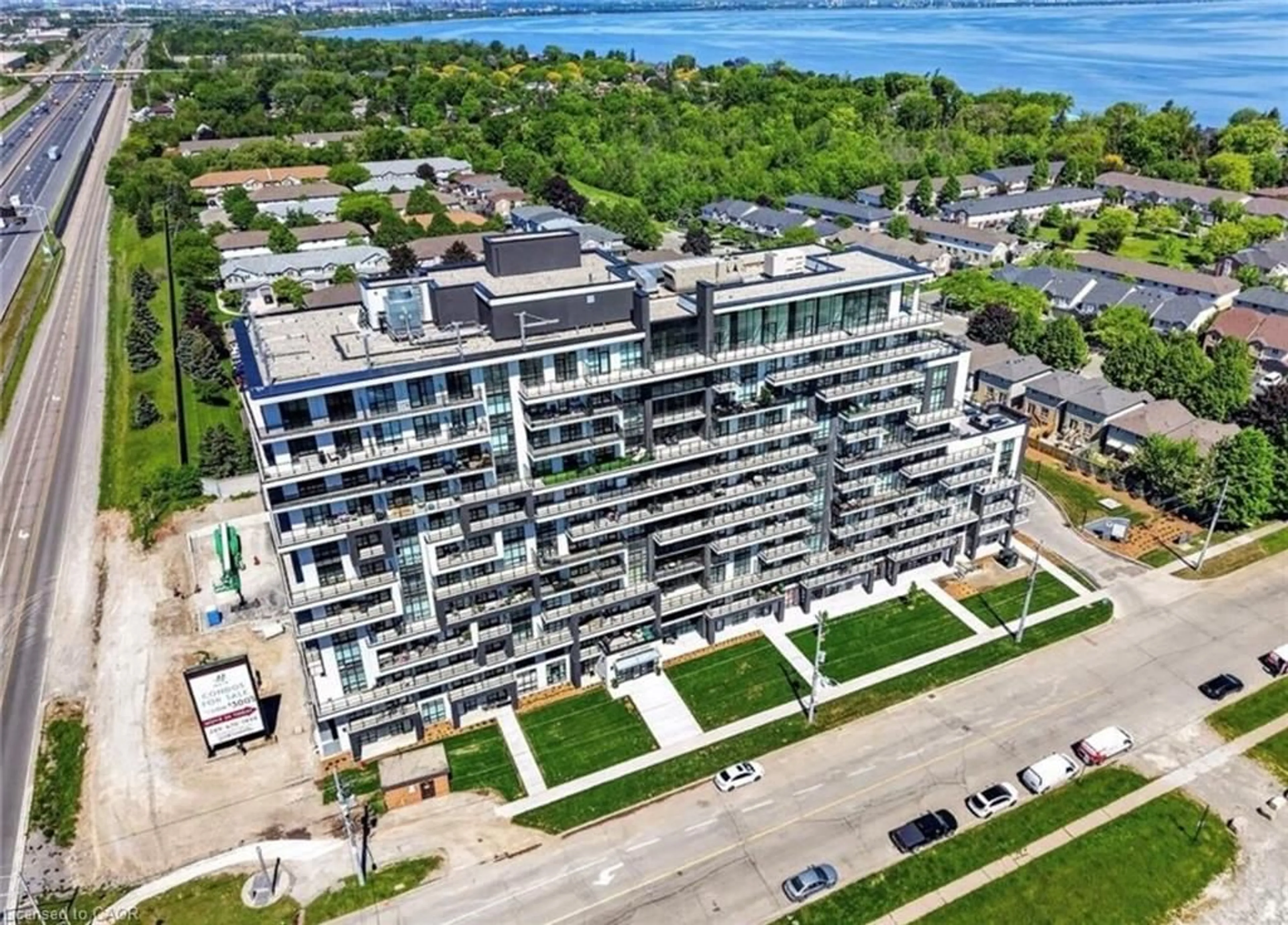 A pic from outside/outdoor area/front of a property/back of a property/a pic from drone, unknown for 461 Green Rd #205, Stoney Creek Ontario L8E 5B4