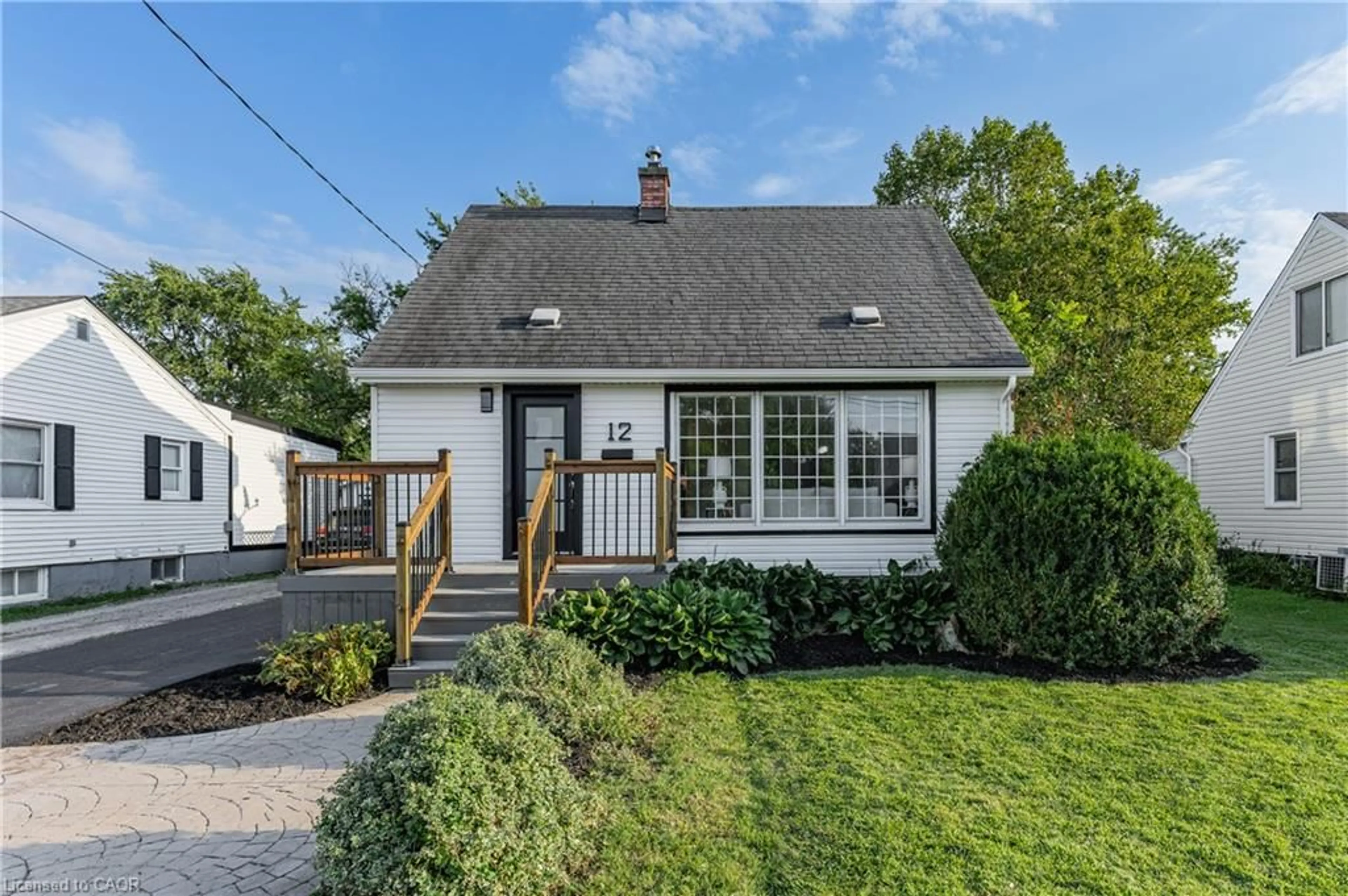 Home with vinyl exterior material, street for 12 Admiral Rd, St. Catharines Ontario L2P 1G5