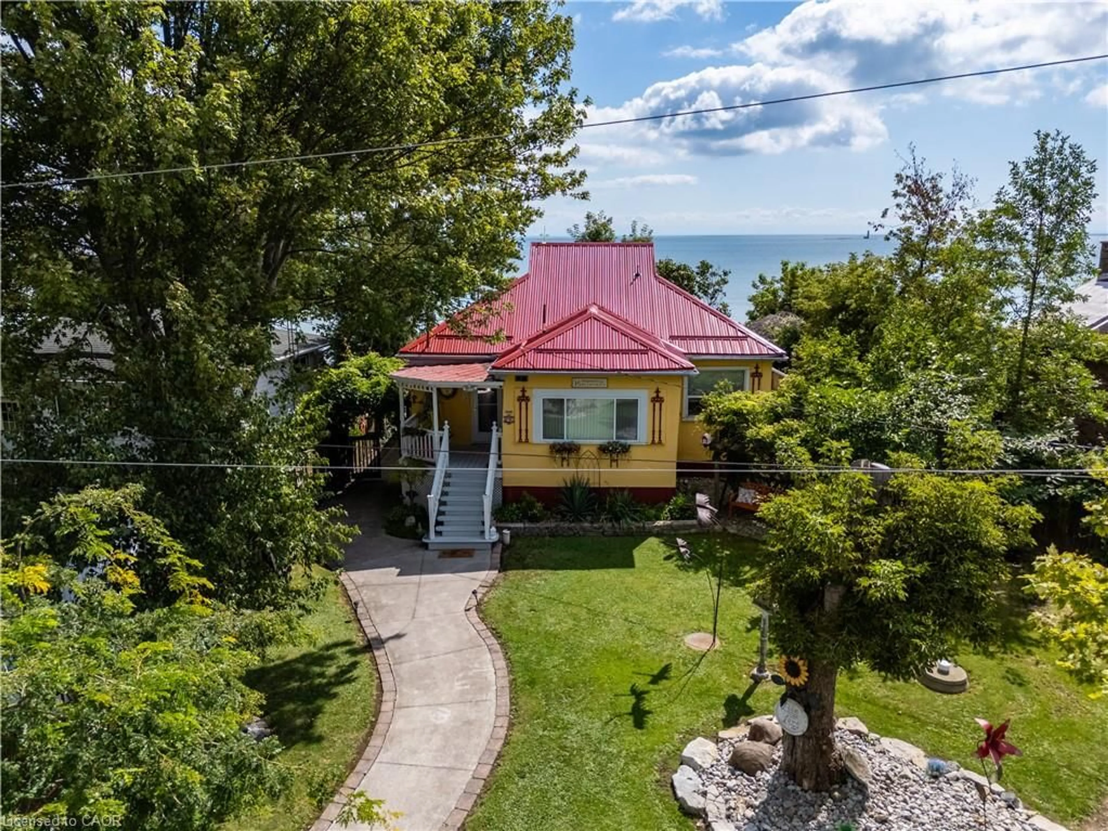 A pic from outside/outdoor area/front of a property/back of a property/a pic from drone, water/lake/river/ocean view for 23 Nature Line, Lowbanks Ontario N0A 1K0