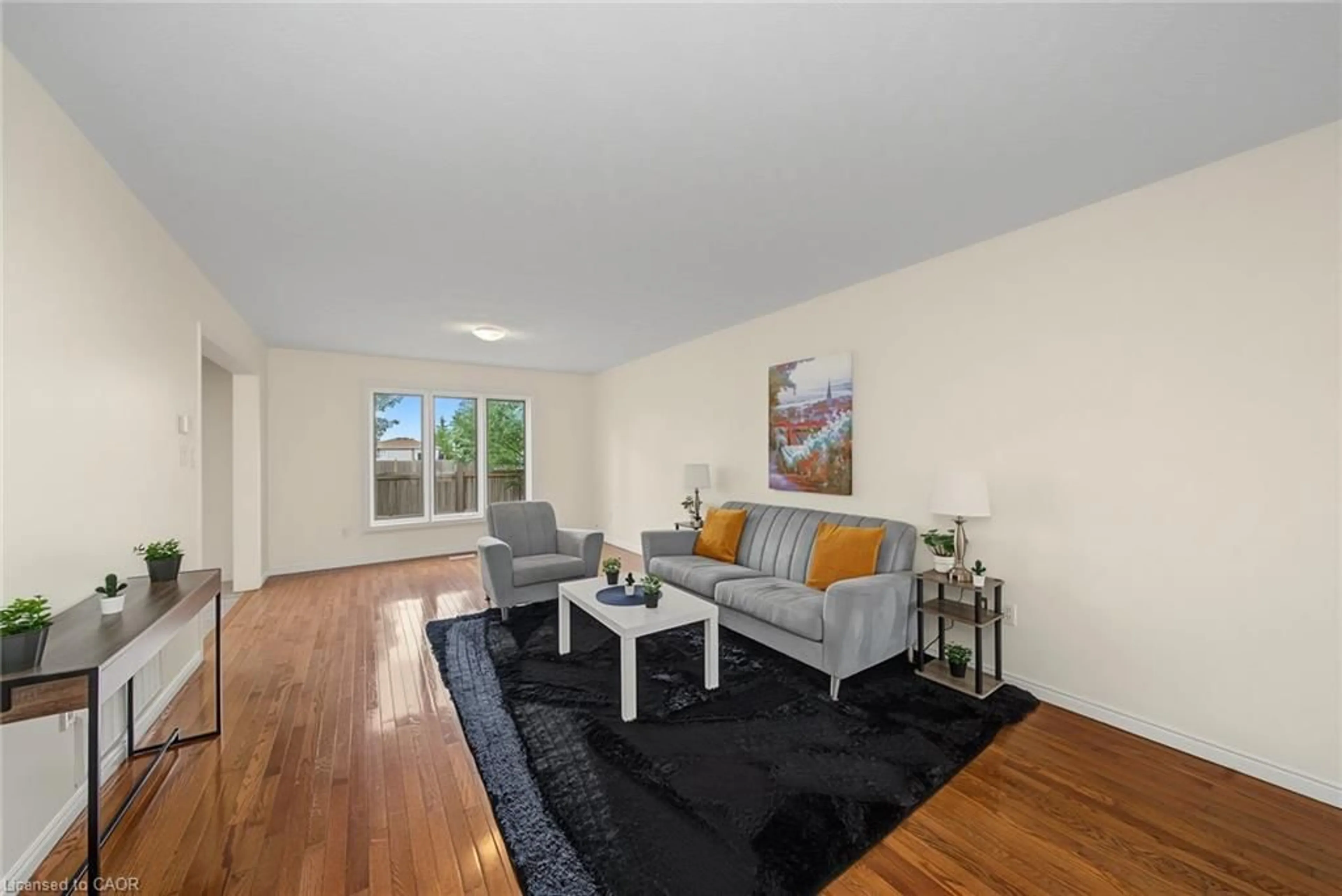 Living room with furniture, wood/laminate floor for 11 Sedona Crt, Hamilton Ontario L9B 2R1