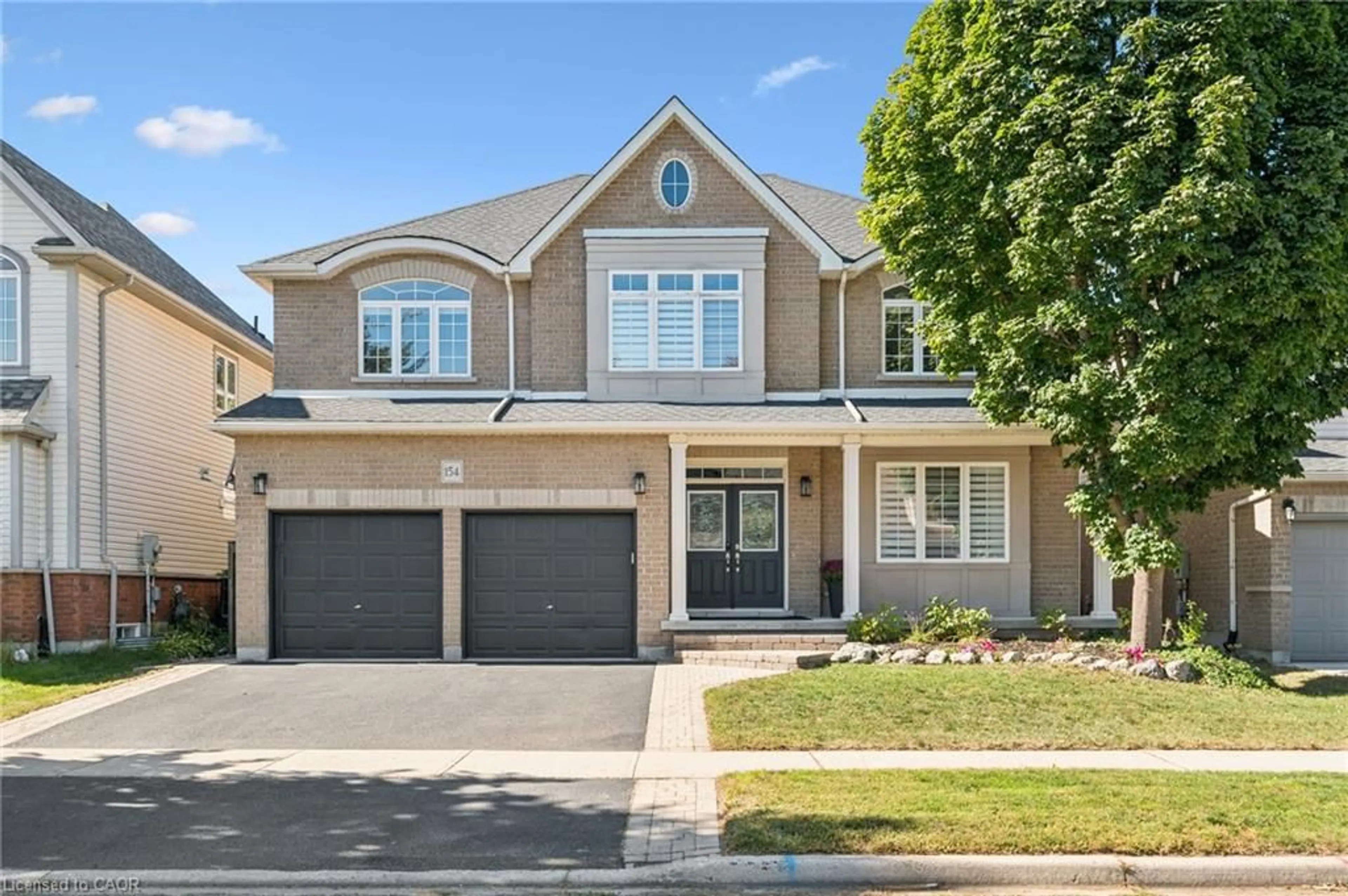 Home with brick exterior material, street for 154 Falconridge Dr, Kitchener Ontario N2K 4J9