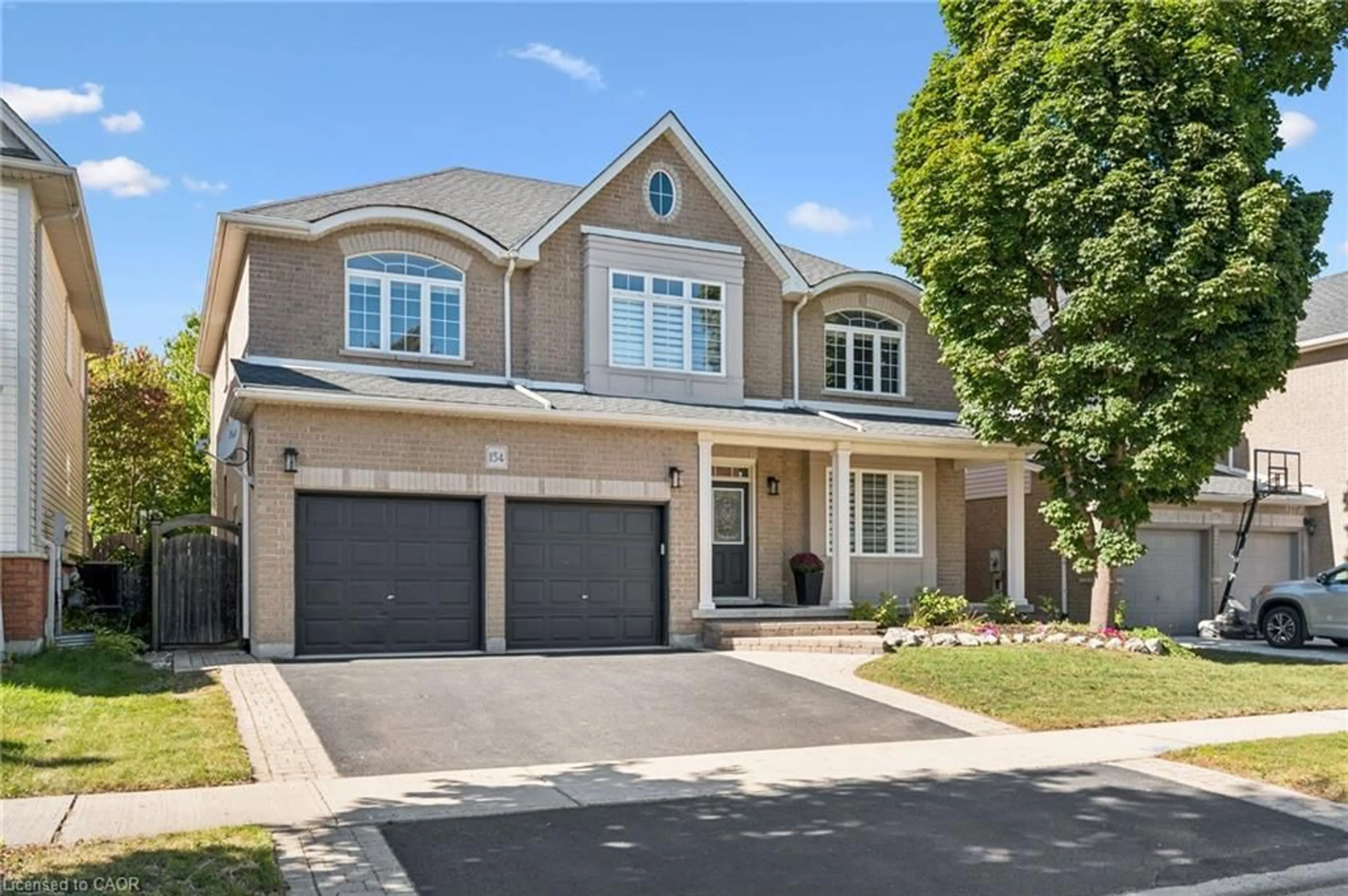 Home with brick exterior material, street for 154 Falconridge Dr, Kitchener Ontario N2K 4J9