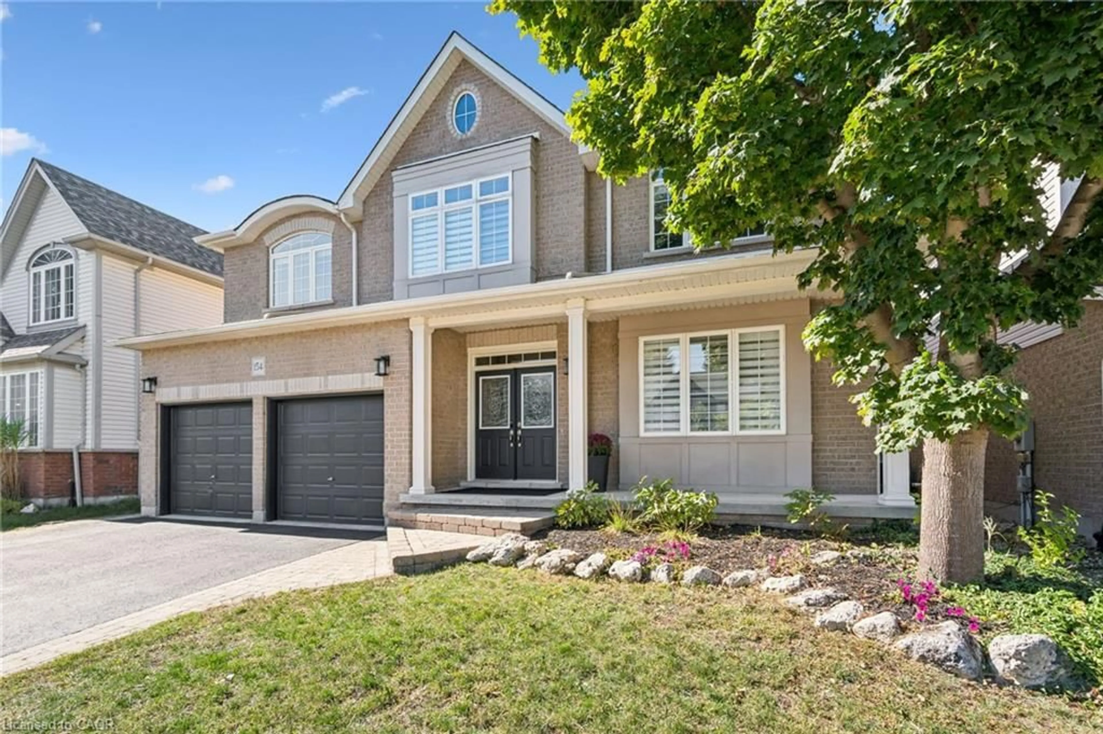 Home with brick exterior material, street for 154 Falconridge Dr, Kitchener Ontario N2K 4J9