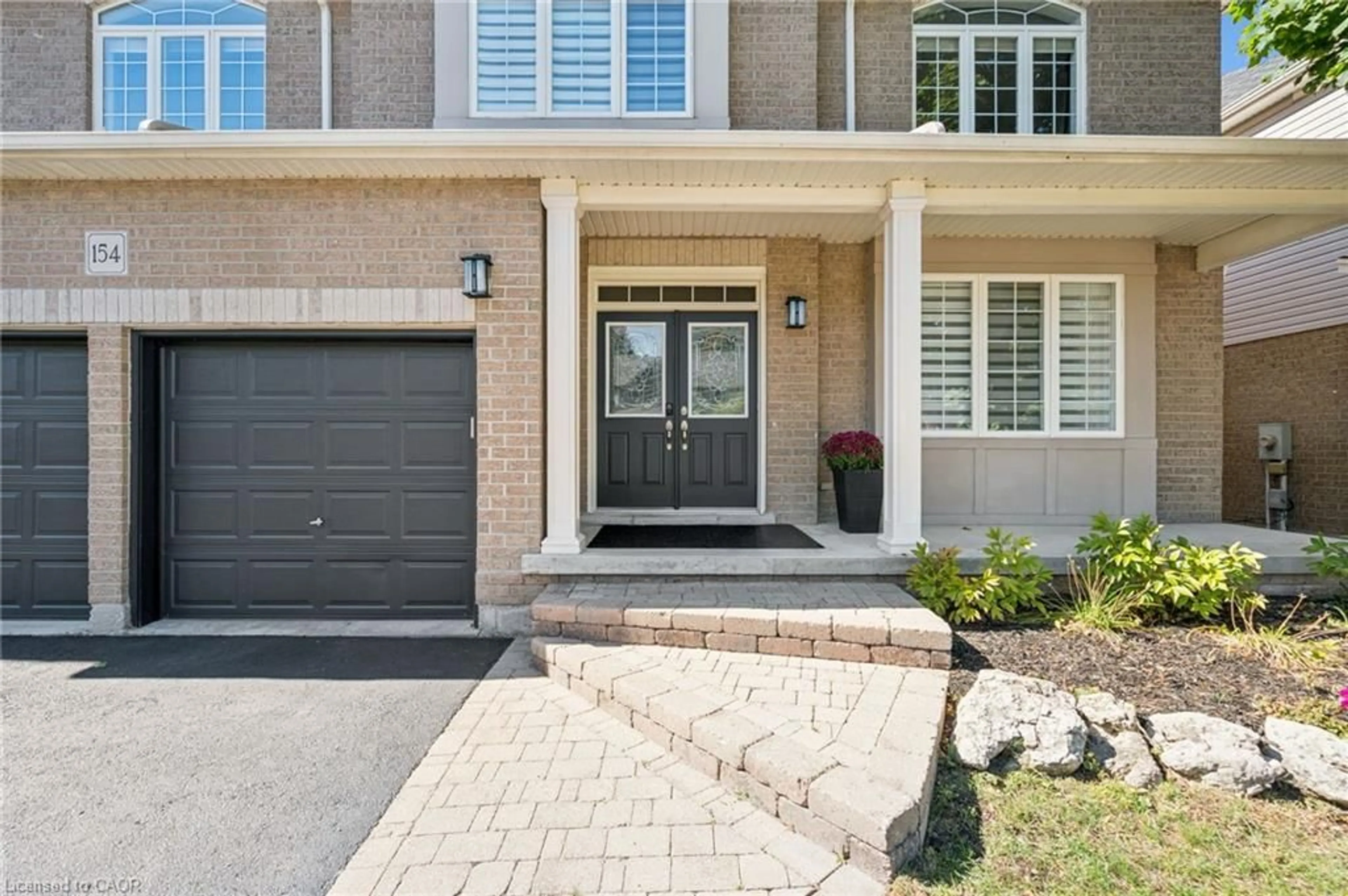 Home with brick exterior material, street for 154 Falconridge Dr, Kitchener Ontario N2K 4J9