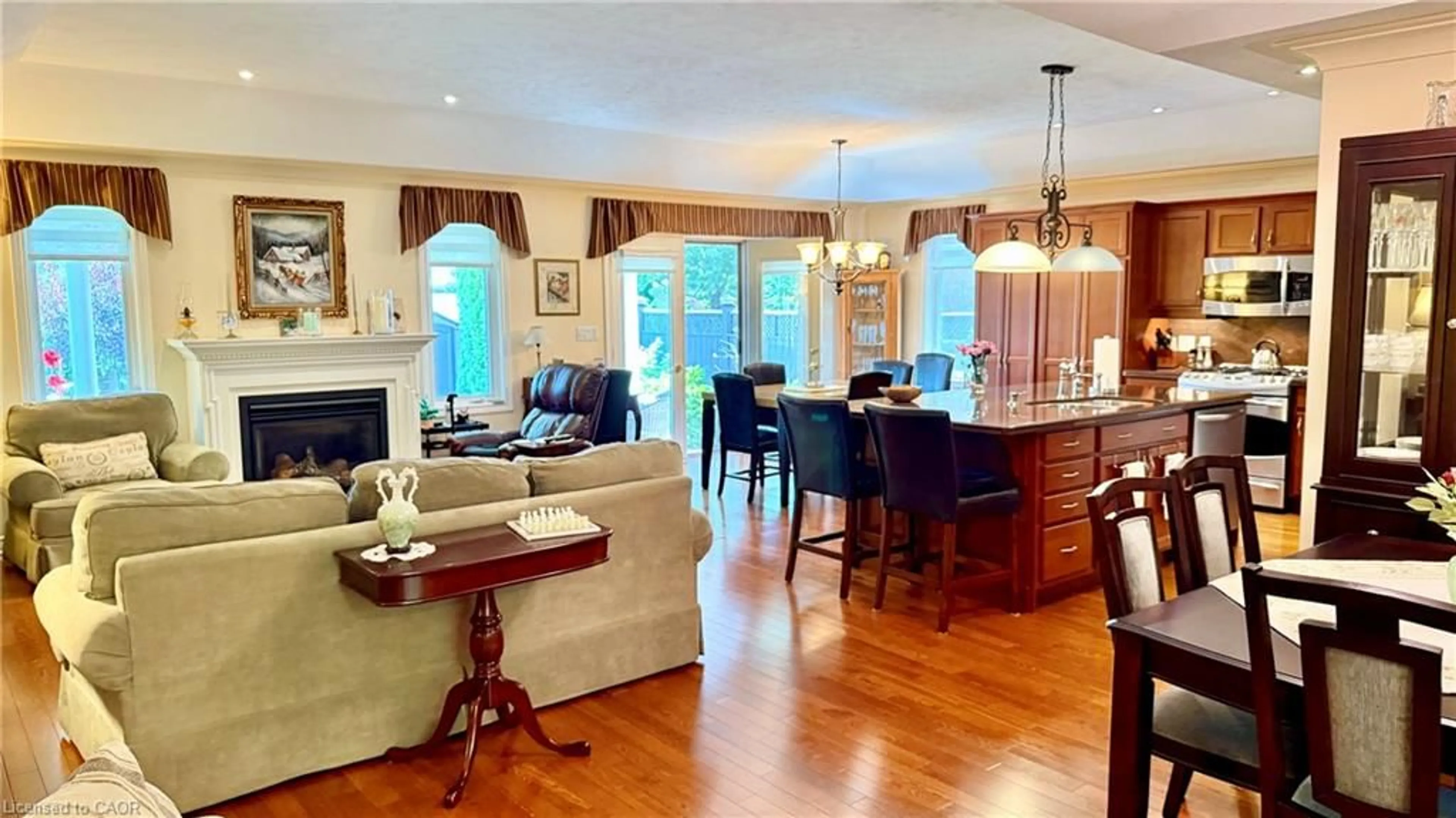 Living room with furniture, wood/laminate floor for 62 Sparrow Way, Port Dover Ontario N0A 1N5