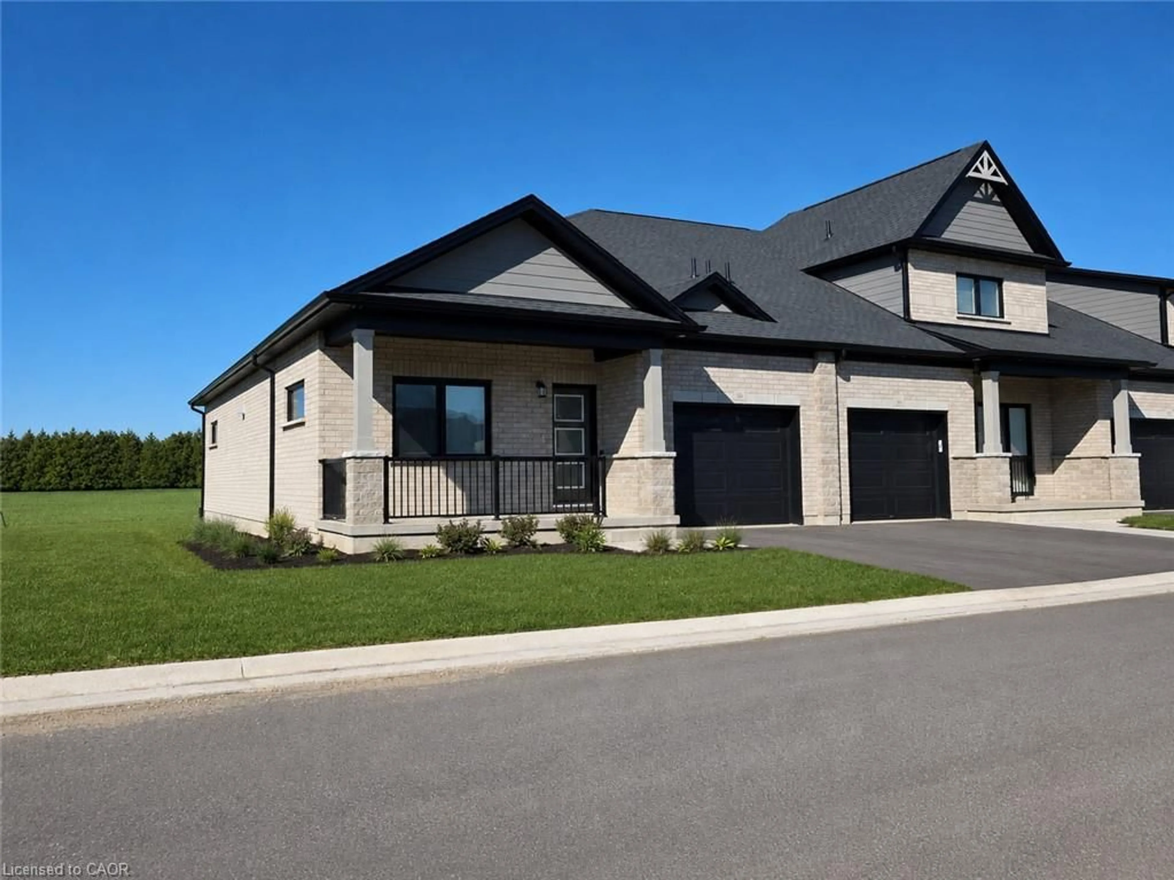 Home with brick exterior material, street for 121 Barn Owl Way, Simcoe Ontario N3Y 0E3