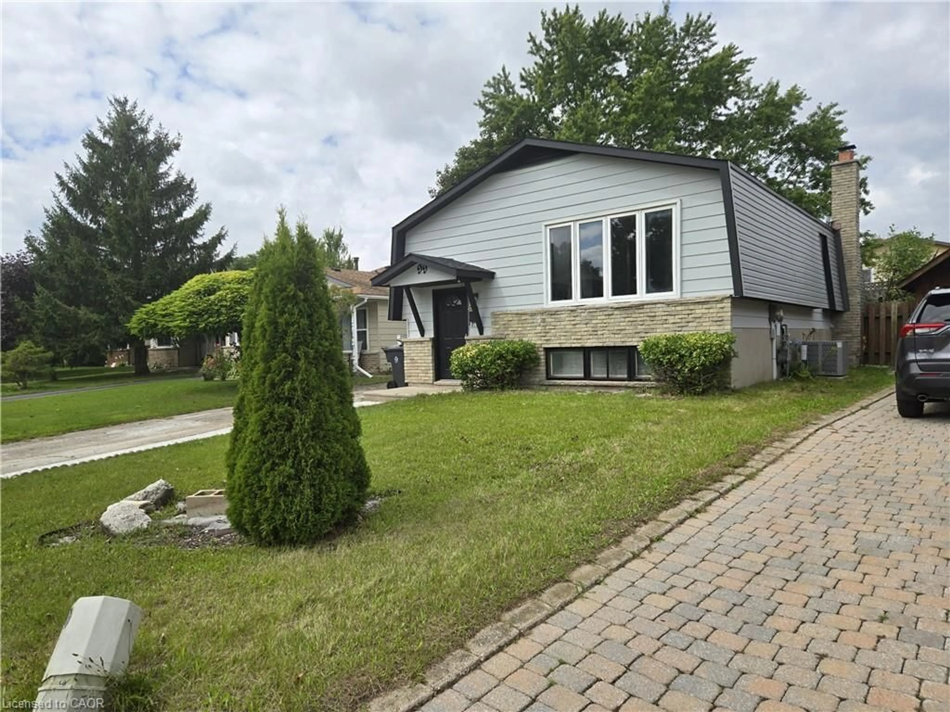 Home with vinyl exterior material, street for 99 Cluthe Cres, Kitchener Ontario N2P 1N1