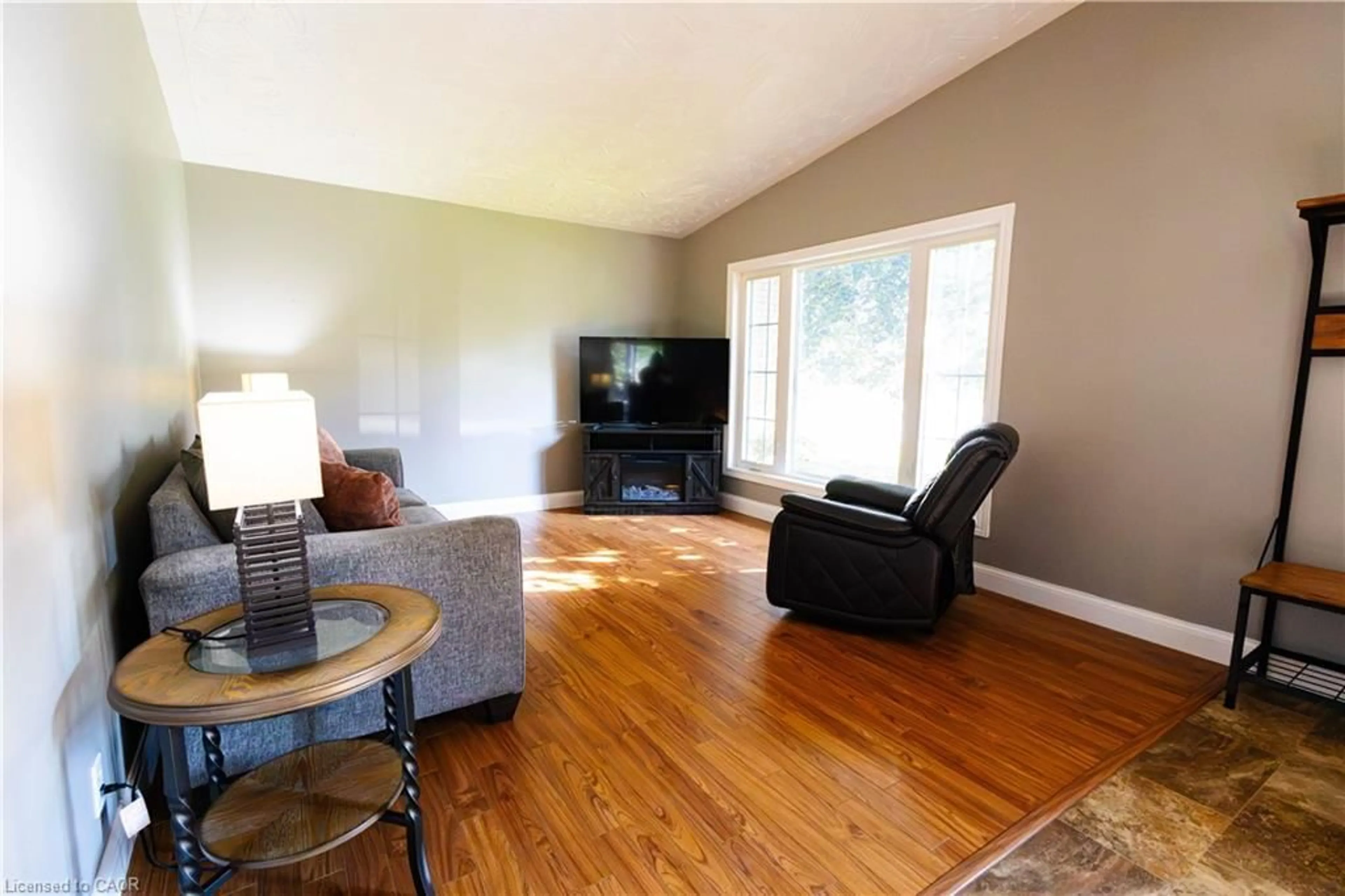 Living room with furniture, wood/laminate floor for 25 Thomas St, Teeswater Ontario N0G 2S0