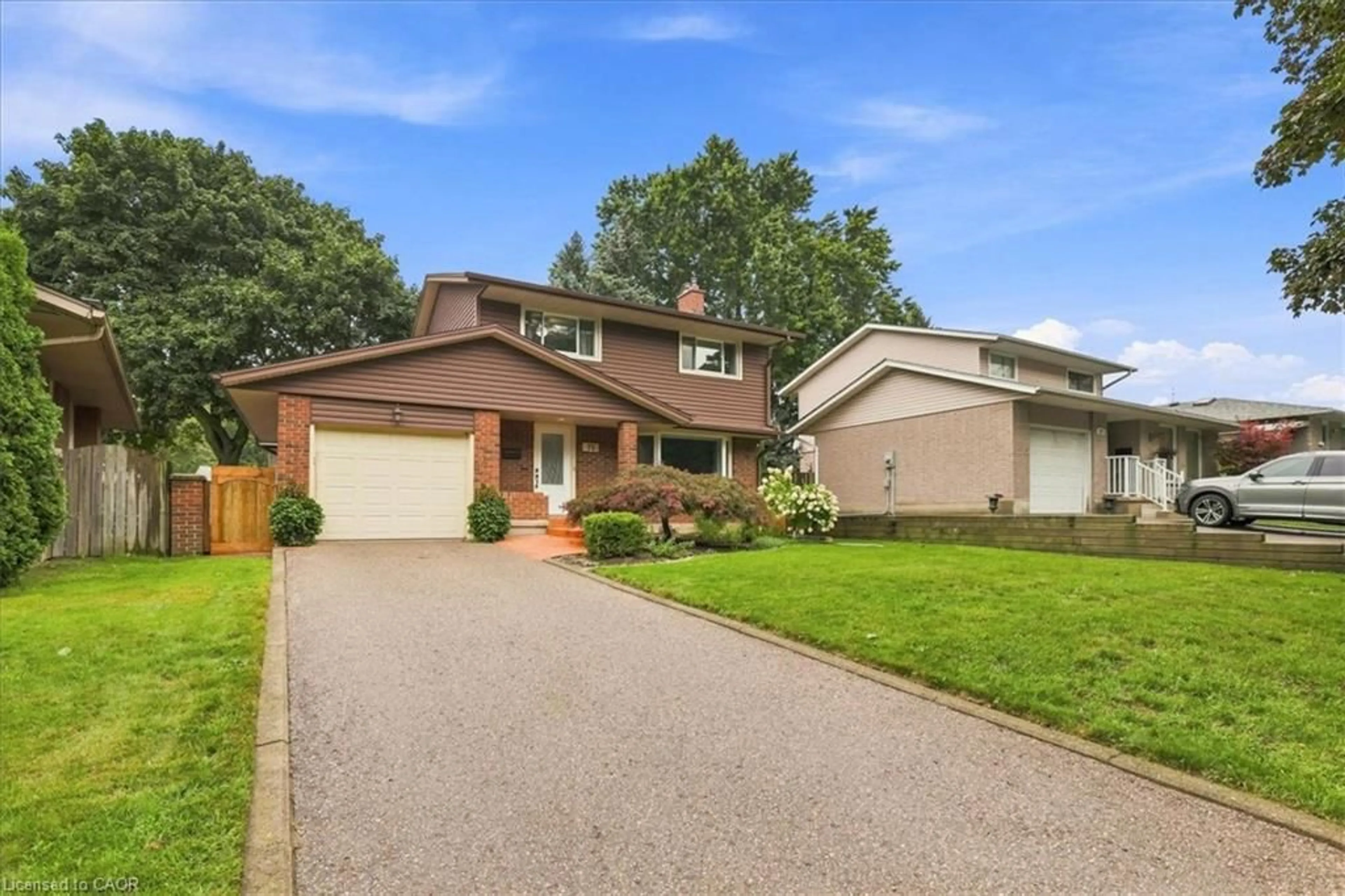 Home with brick exterior material, street for 71 Greenock Dr, Kitchener Ontario N2E 2J9