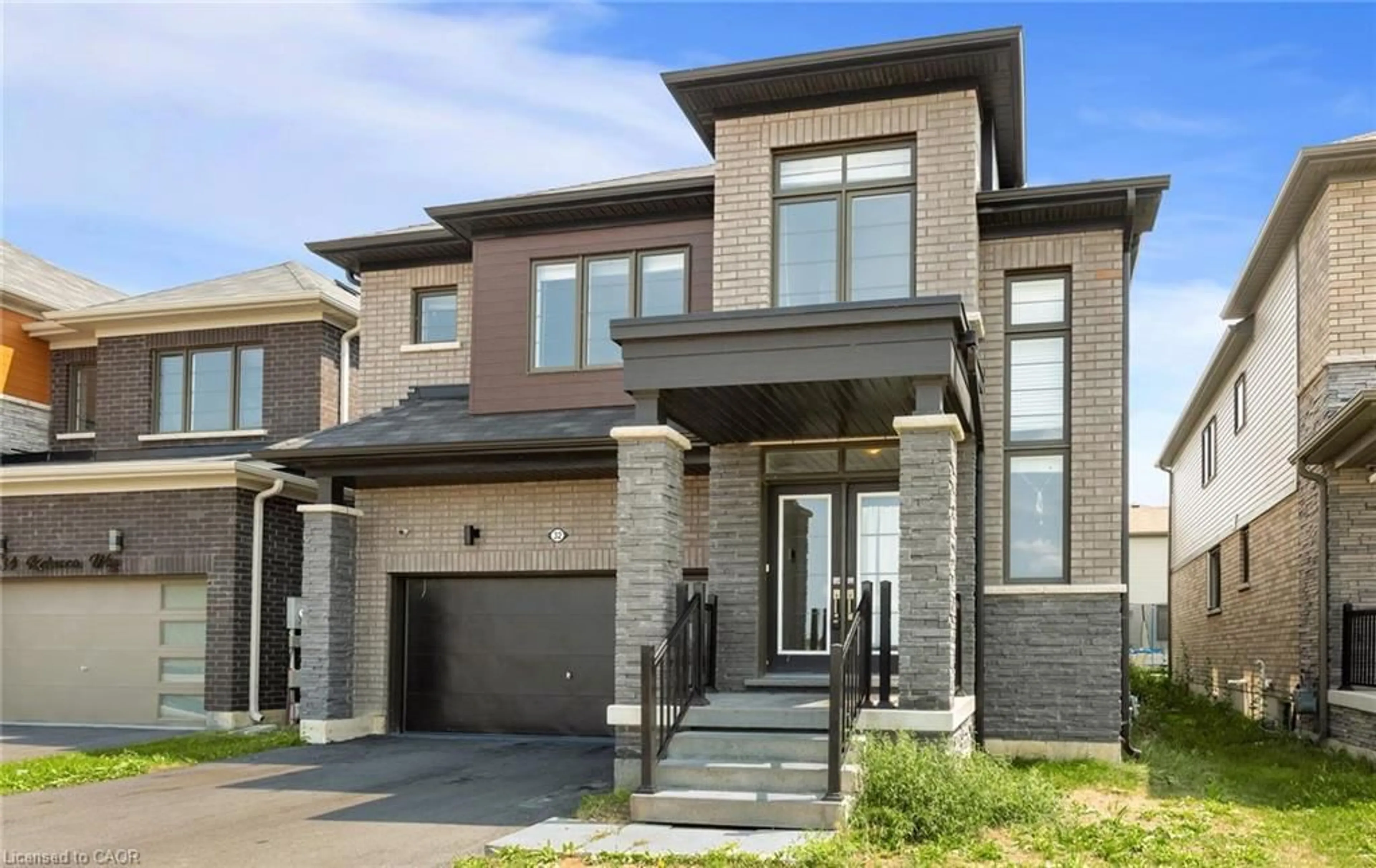 Home with brick exterior material, street for 32 Rebecca Way, Caledonia Ontario N3W 0E1