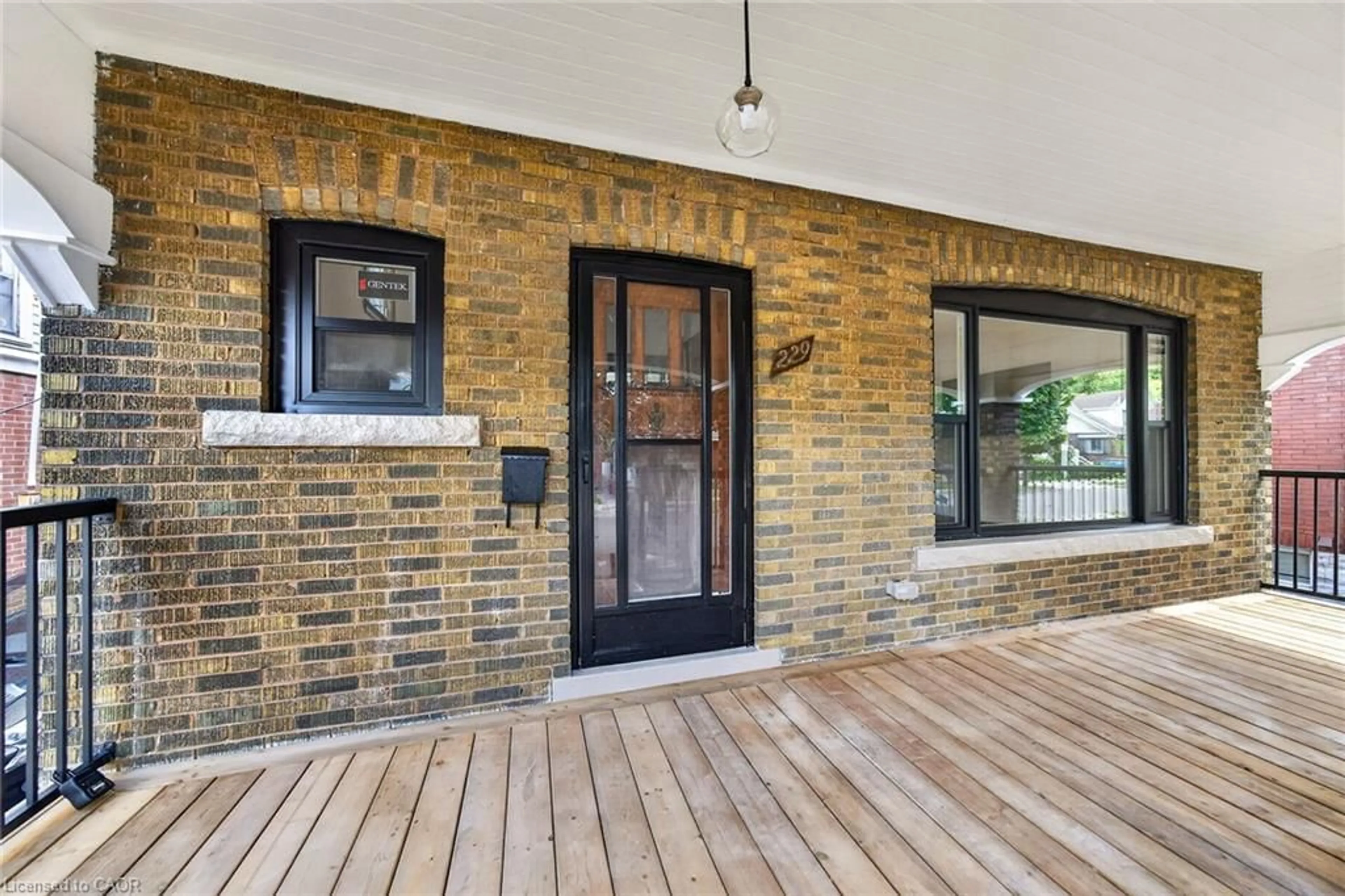 Home with brick exterior material, street for 229 Park Row, Hamilton Ontario L8K 2K4