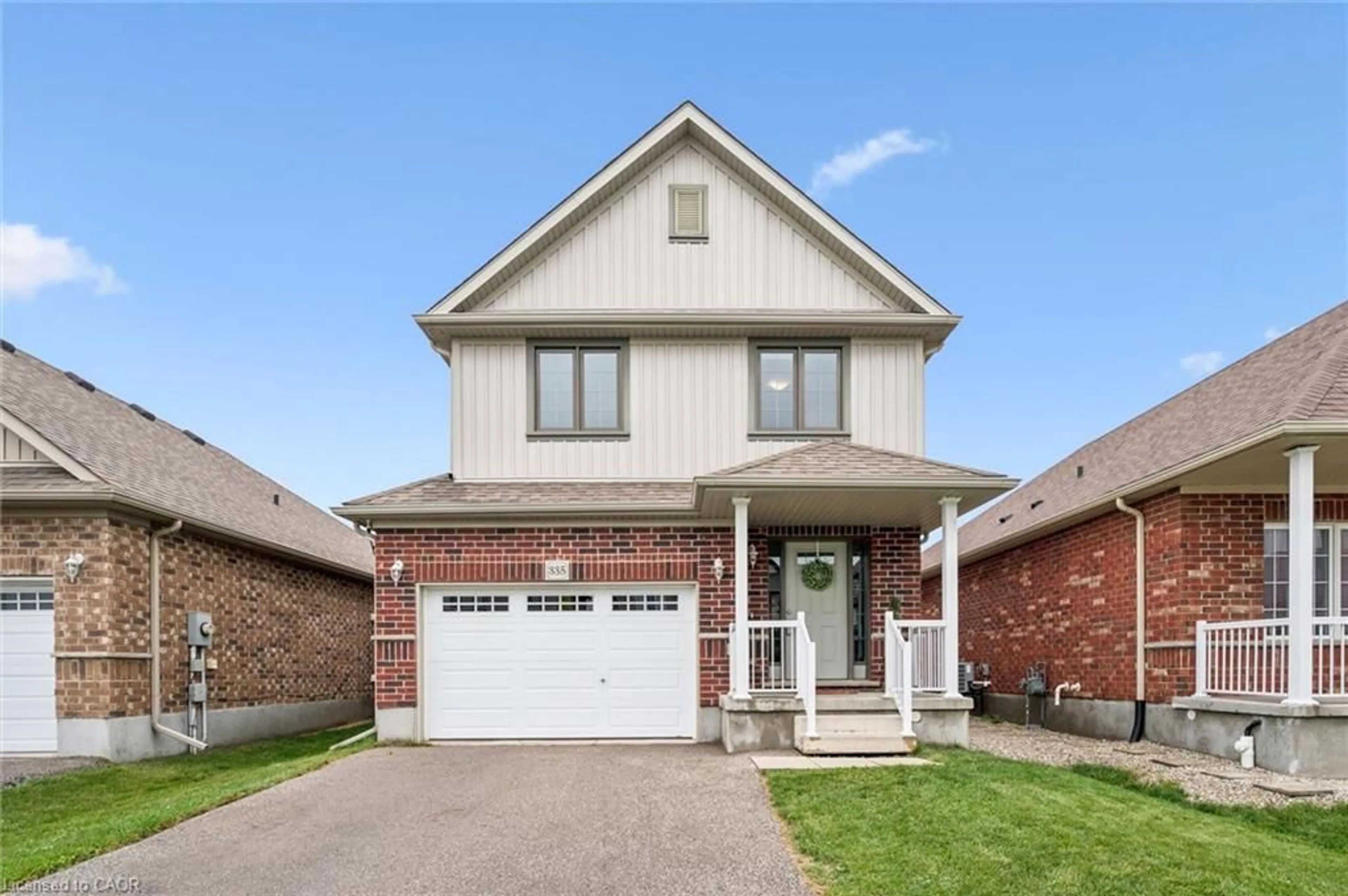 Home with brick exterior material, street for 335 Finoro Cres, Elmira Ontario N3B 0C3