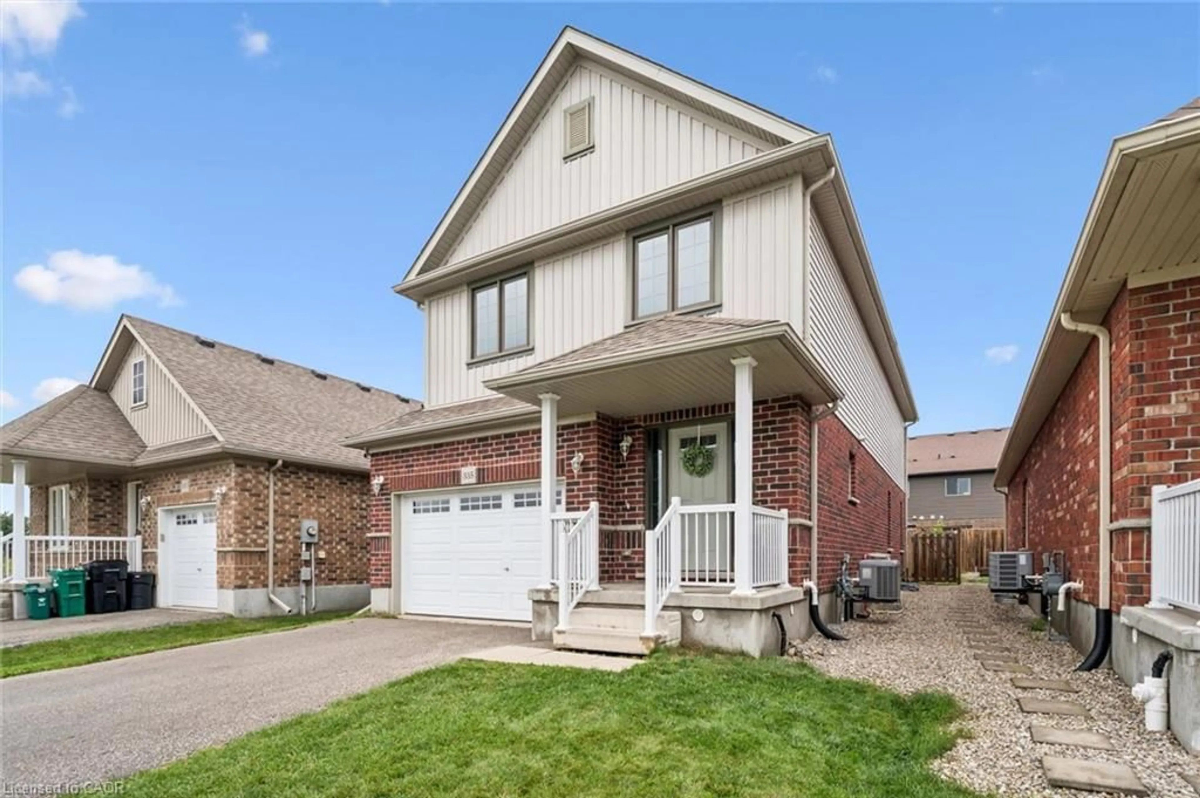 Home with brick exterior material, street for 335 Finoro Cres, Elmira Ontario N3B 0C3