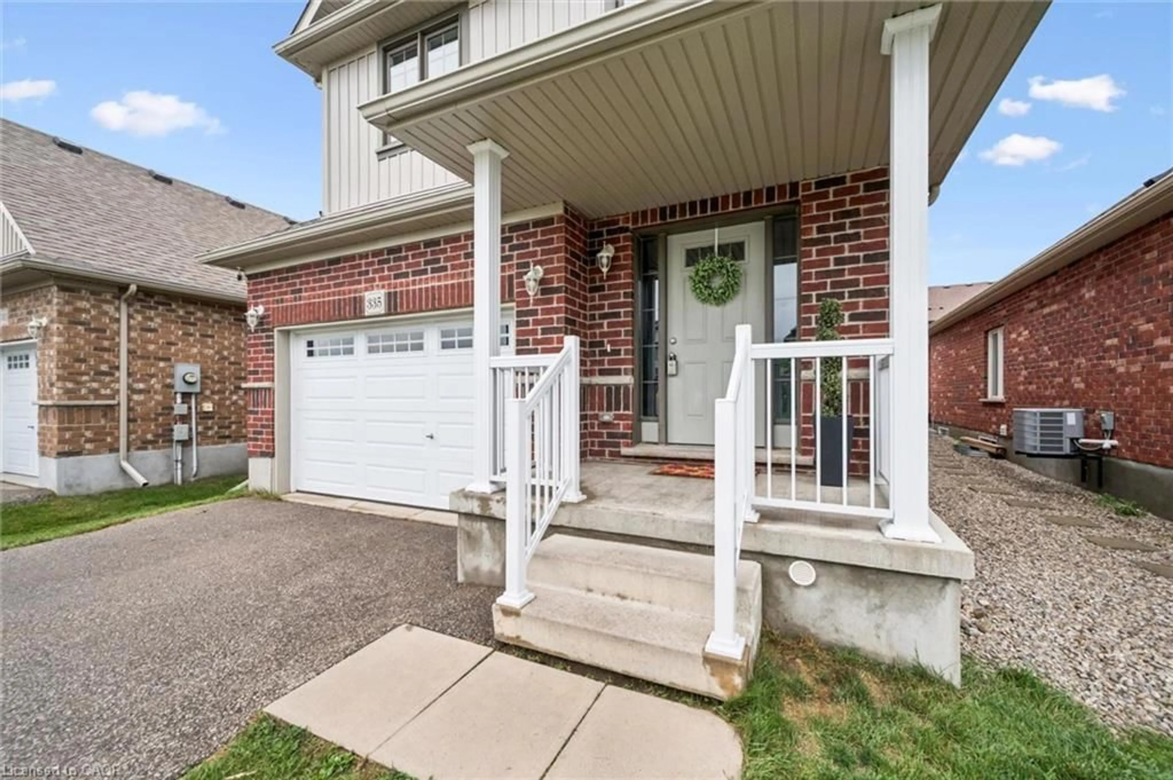 Home with brick exterior material, street for 335 Finoro Cres, Elmira Ontario N3B 0C3