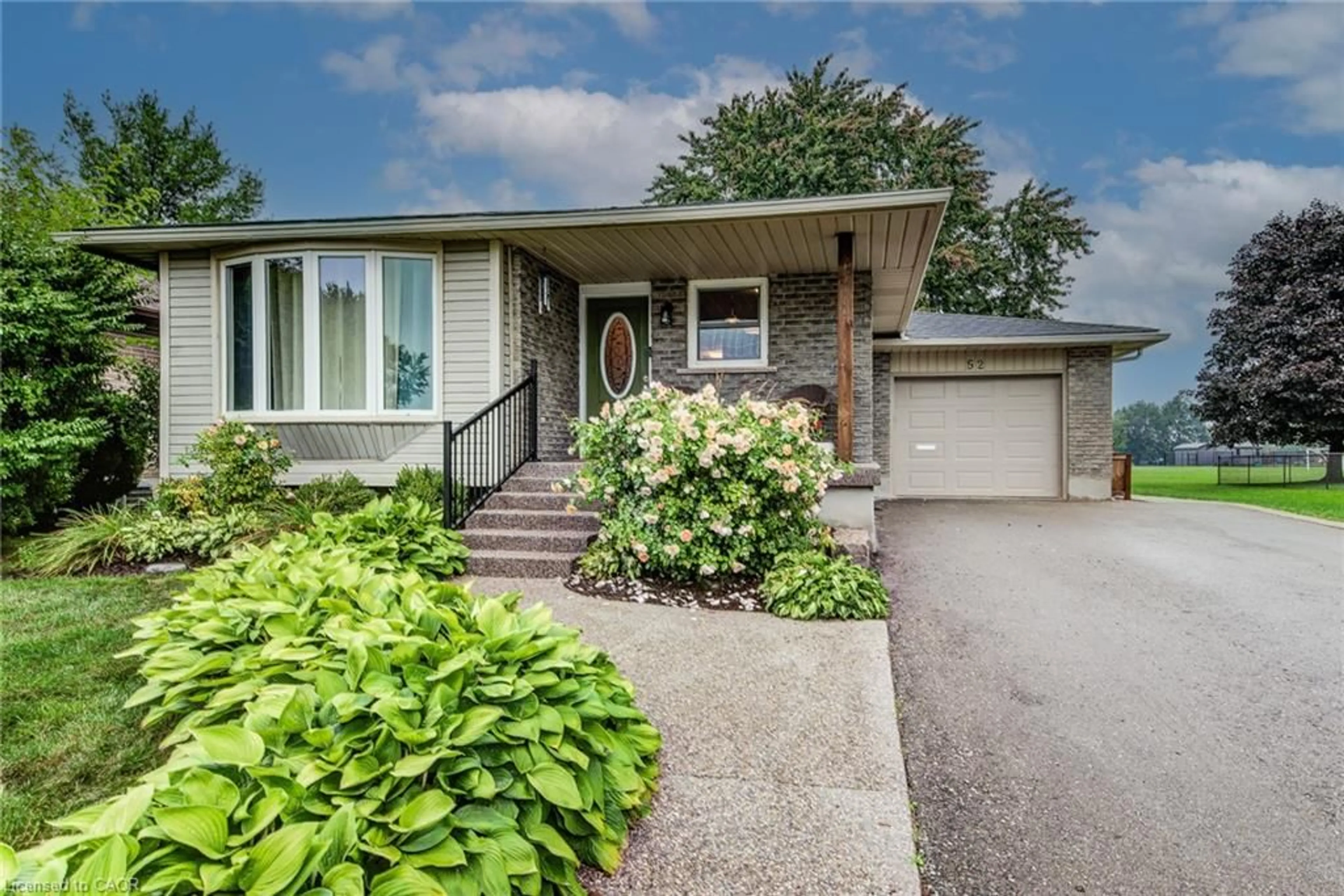 Home with brick exterior material, street for 52 Mockingbird Dr, Elmira Ontario N3B 3A6