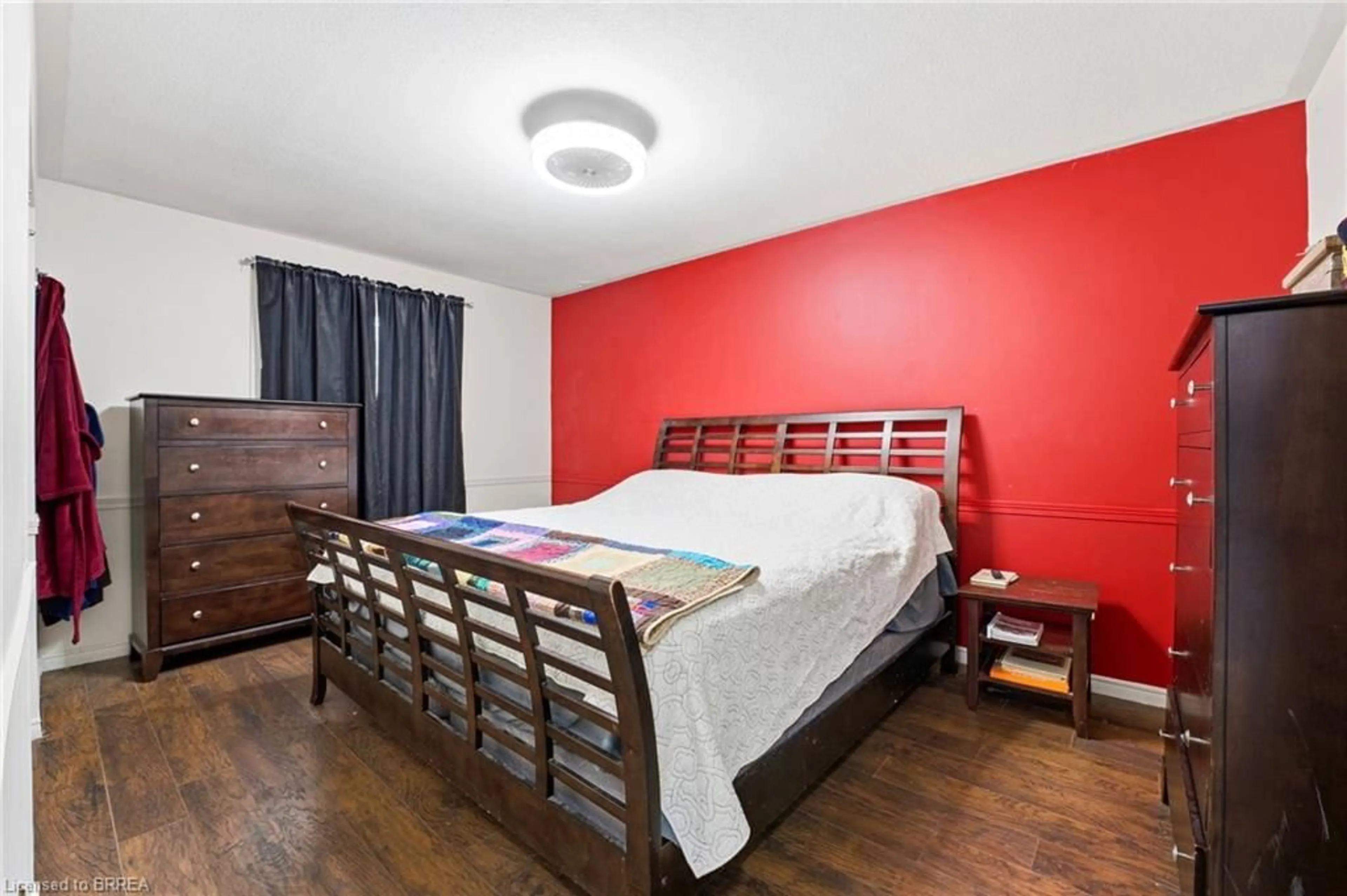 Bedroom with bed, wood/laminate floor for 179 Banbury Rd, Brantford Ontario N3P 1E6