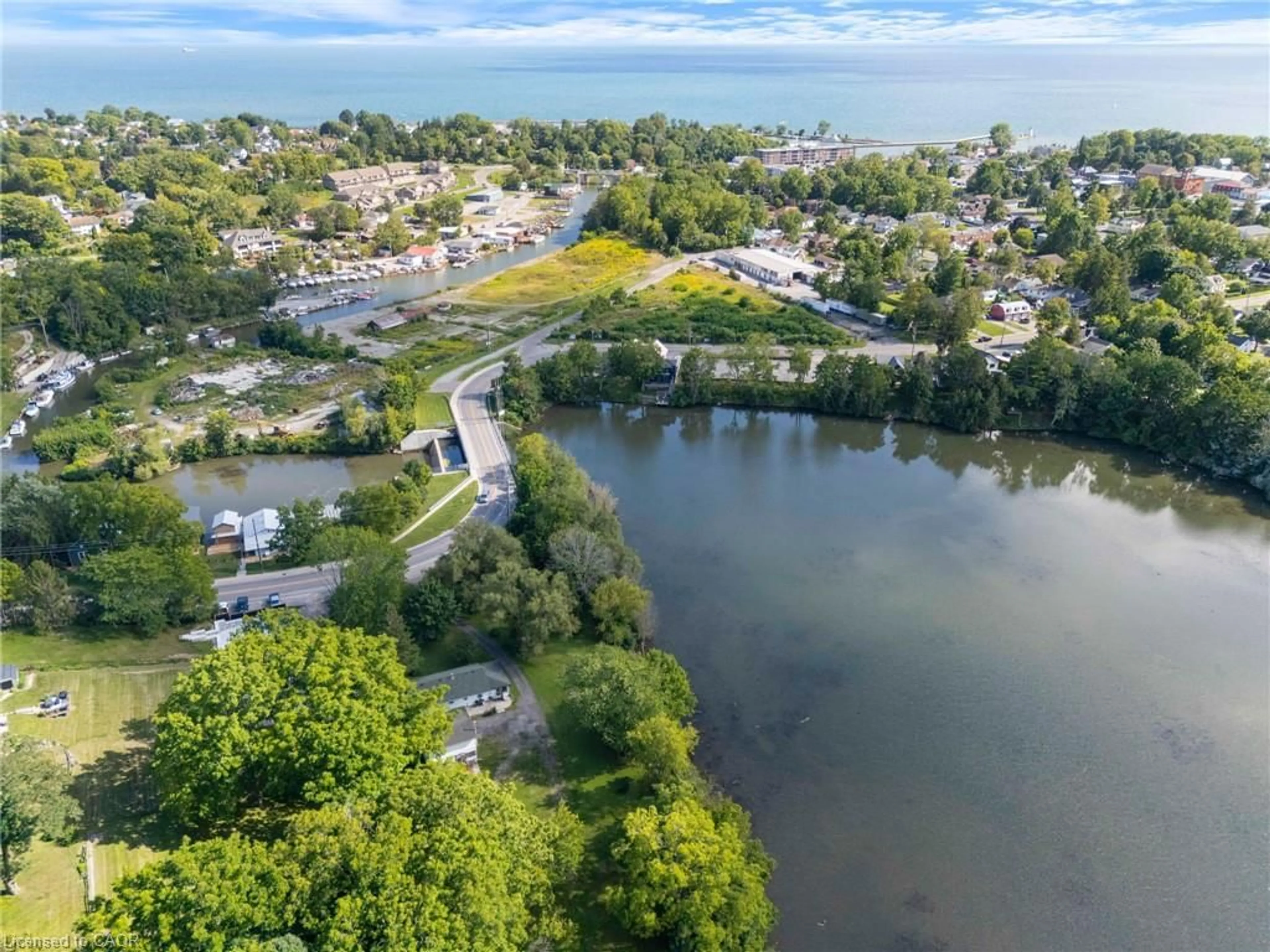 A pic from outside/outdoor area/front of a property/back of a property/a pic from drone, water/lake/river/ocean view for 1 Silver Lake Dr, Port Dover Ontario N0A 1N6