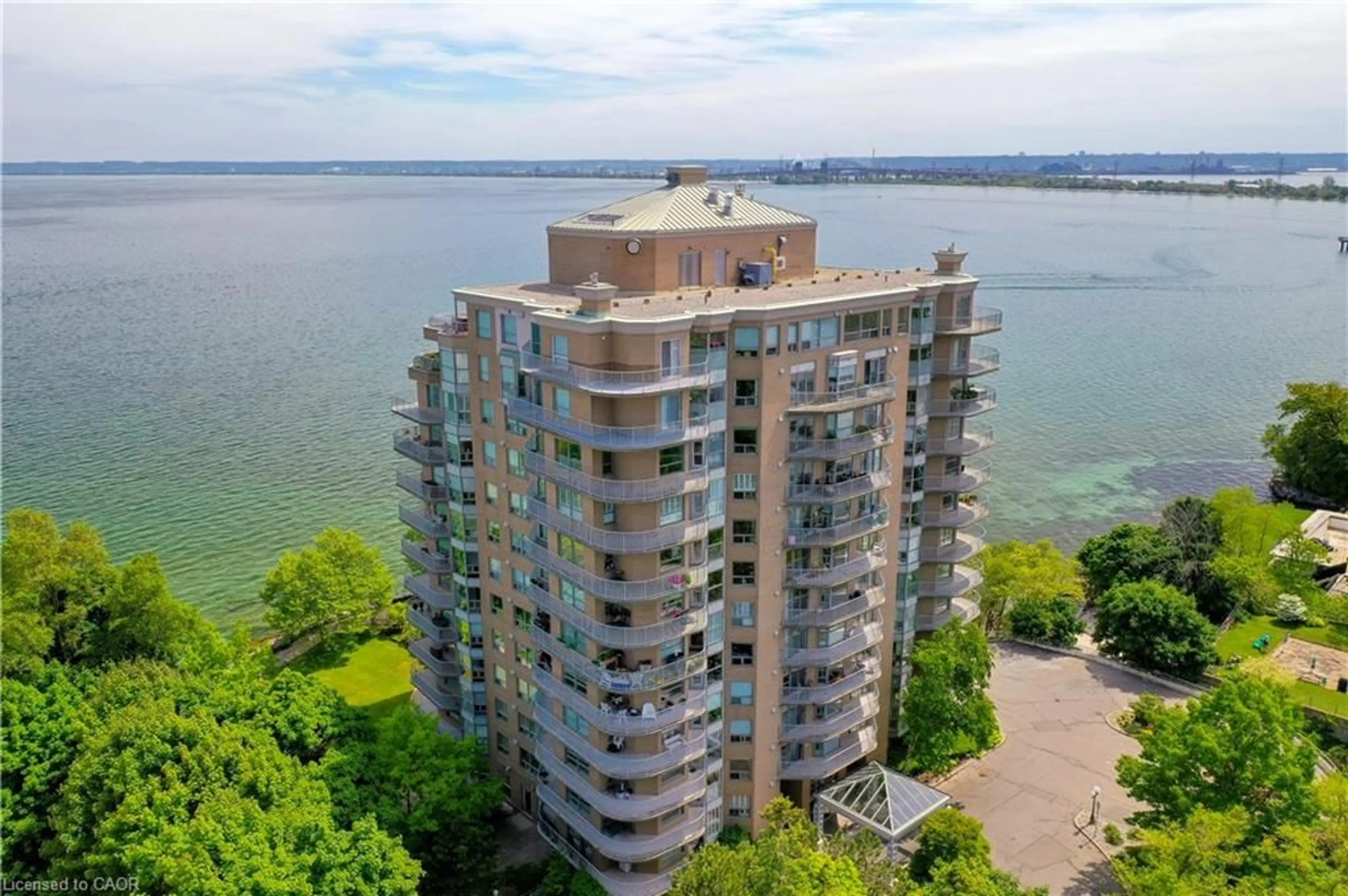 A pic from outside/outdoor area/front of a property/back of a property/a pic from drone, water/lake/river/ocean view for 2190 Lakeshore Rd #304, Burlington Ontario L7R 4K1