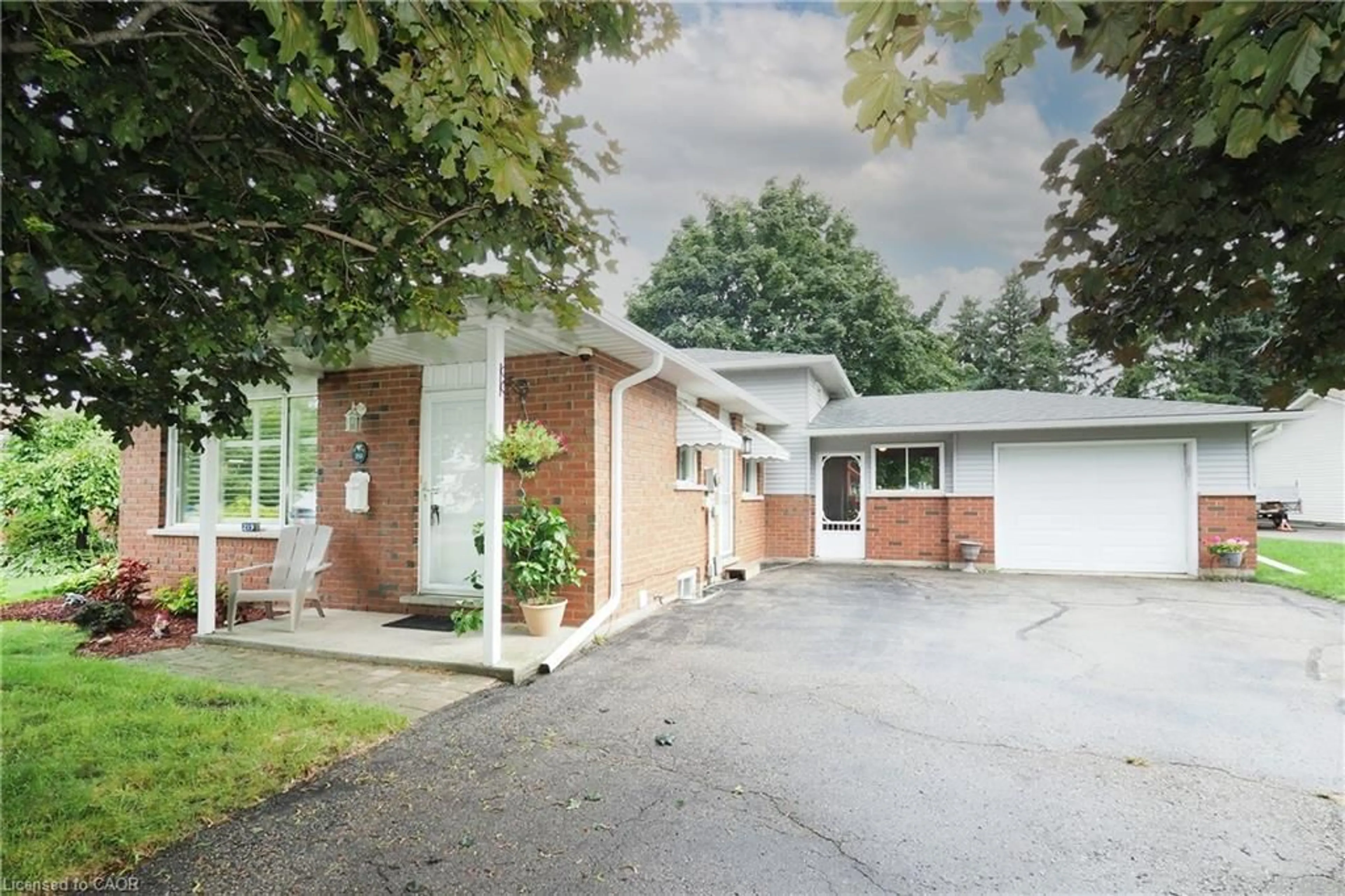 Home with brick exterior material, street for 219 Foxhunt Rd, Waterloo Ontario N2K 2R8