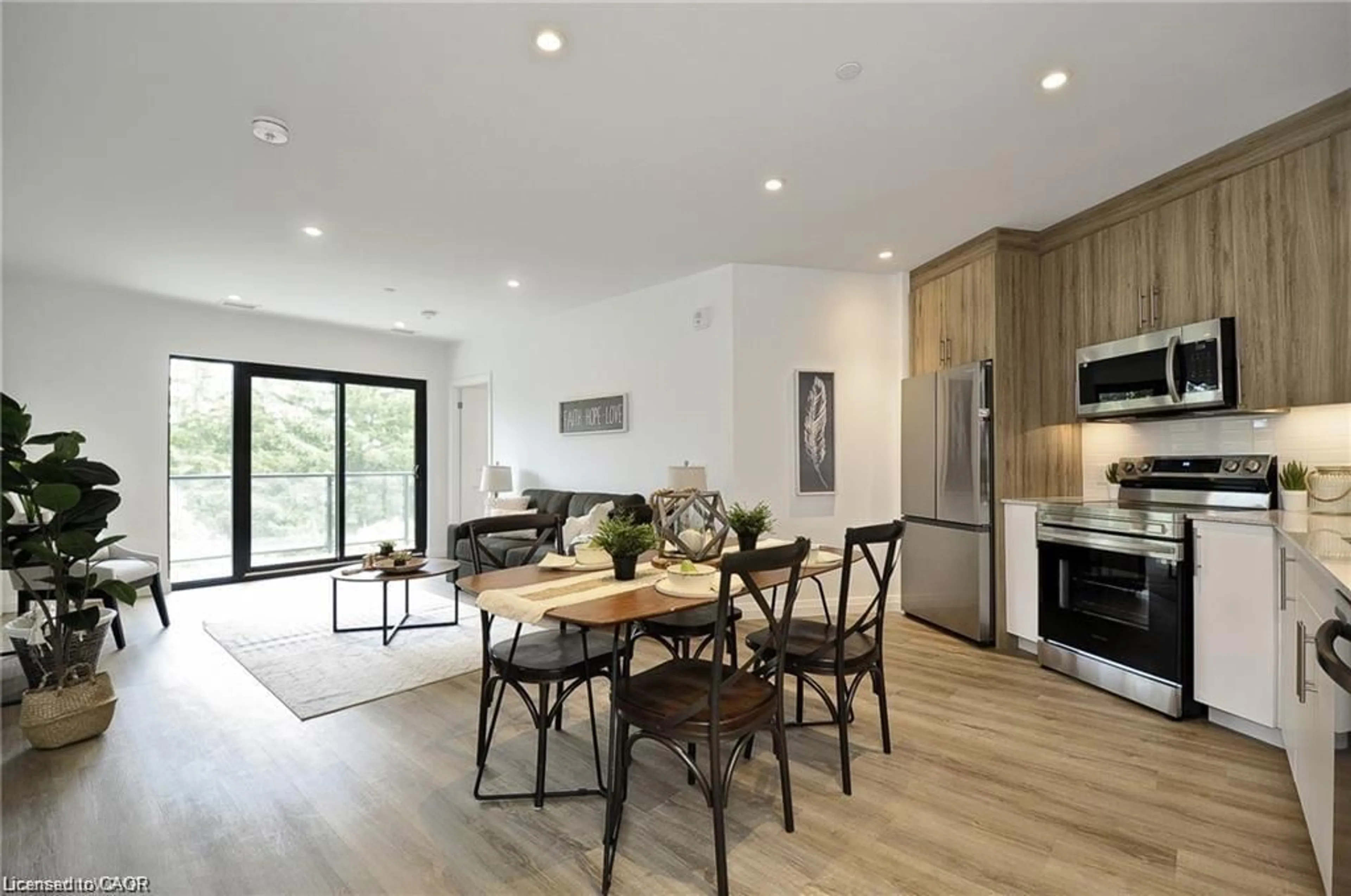 Open concept kitchen, wood/laminate floor for 525 New Dundee Rd #409, Kitchener Ontario N2P 2L1