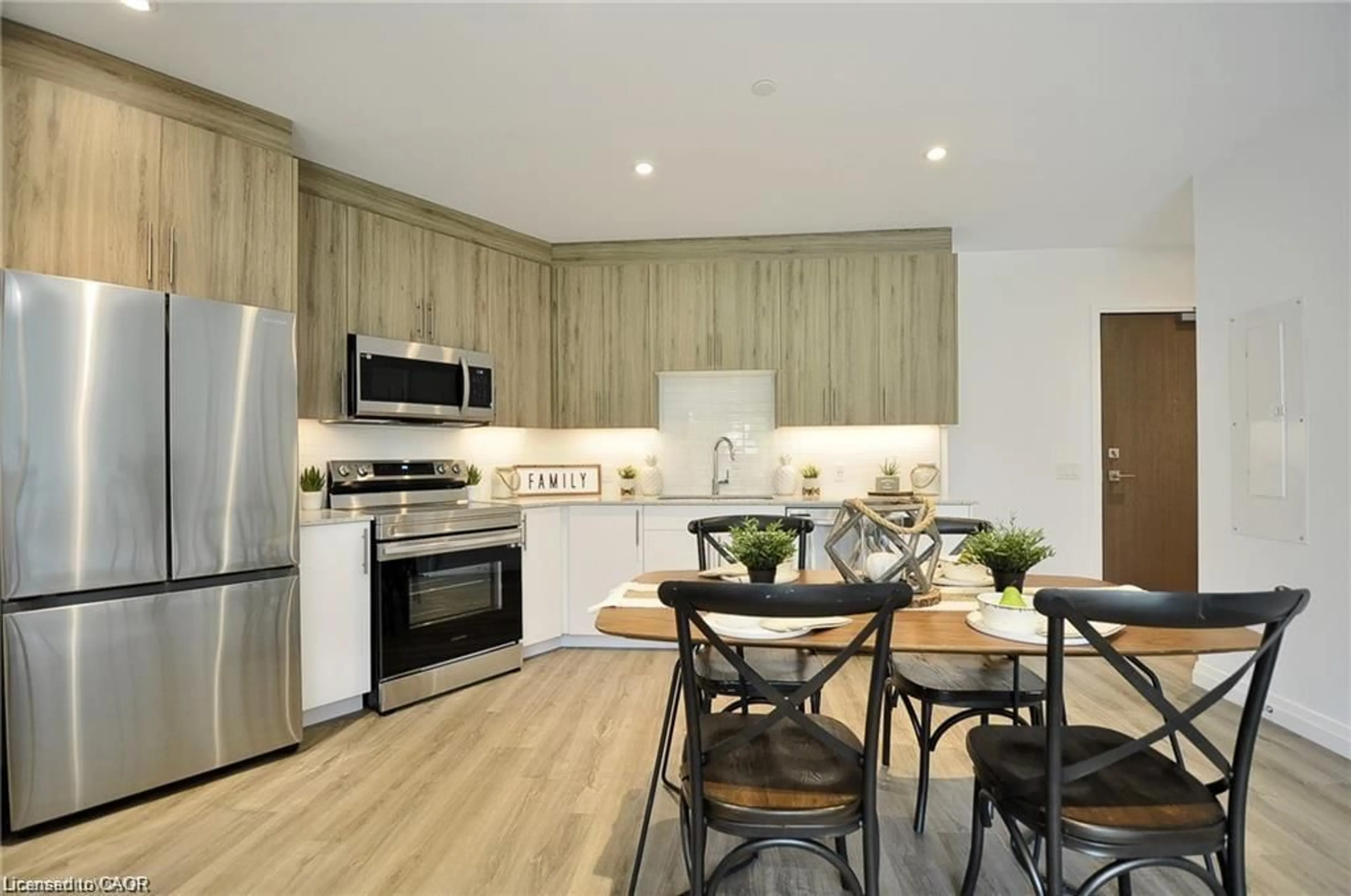 Open concept kitchen, wood/laminate floor for 525 New Dundee Rd #409, Kitchener Ontario N2P 2L1