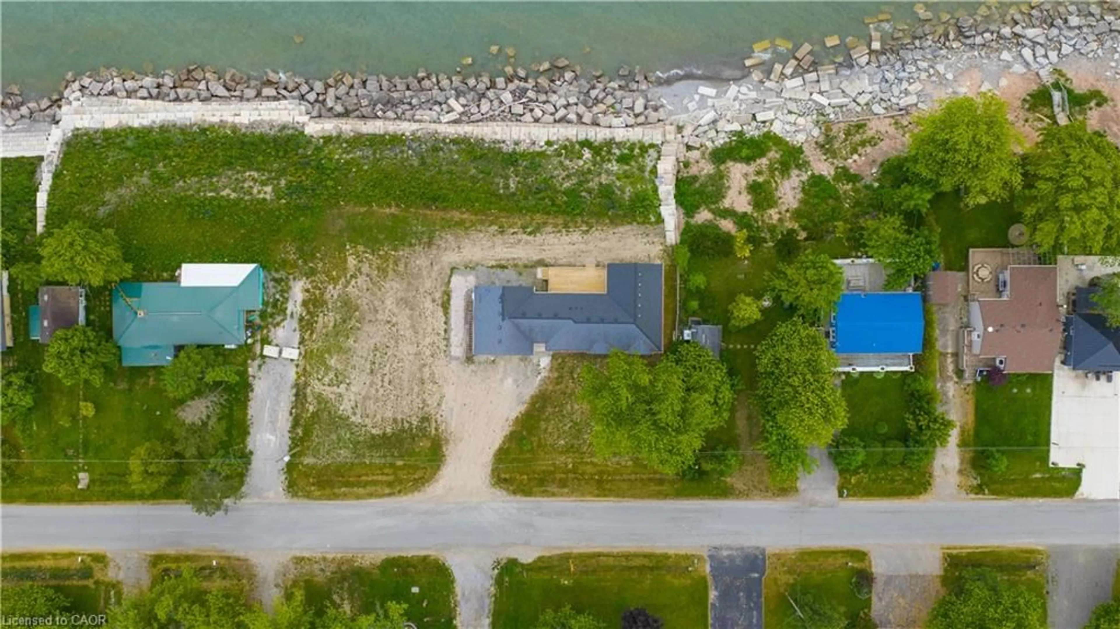 A pic from outside/outdoor area/front of a property/back of a property/a pic from drone, water/lake/river/ocean view for 21 Villella Rd, Lowbanks Ontario N0A 1K0