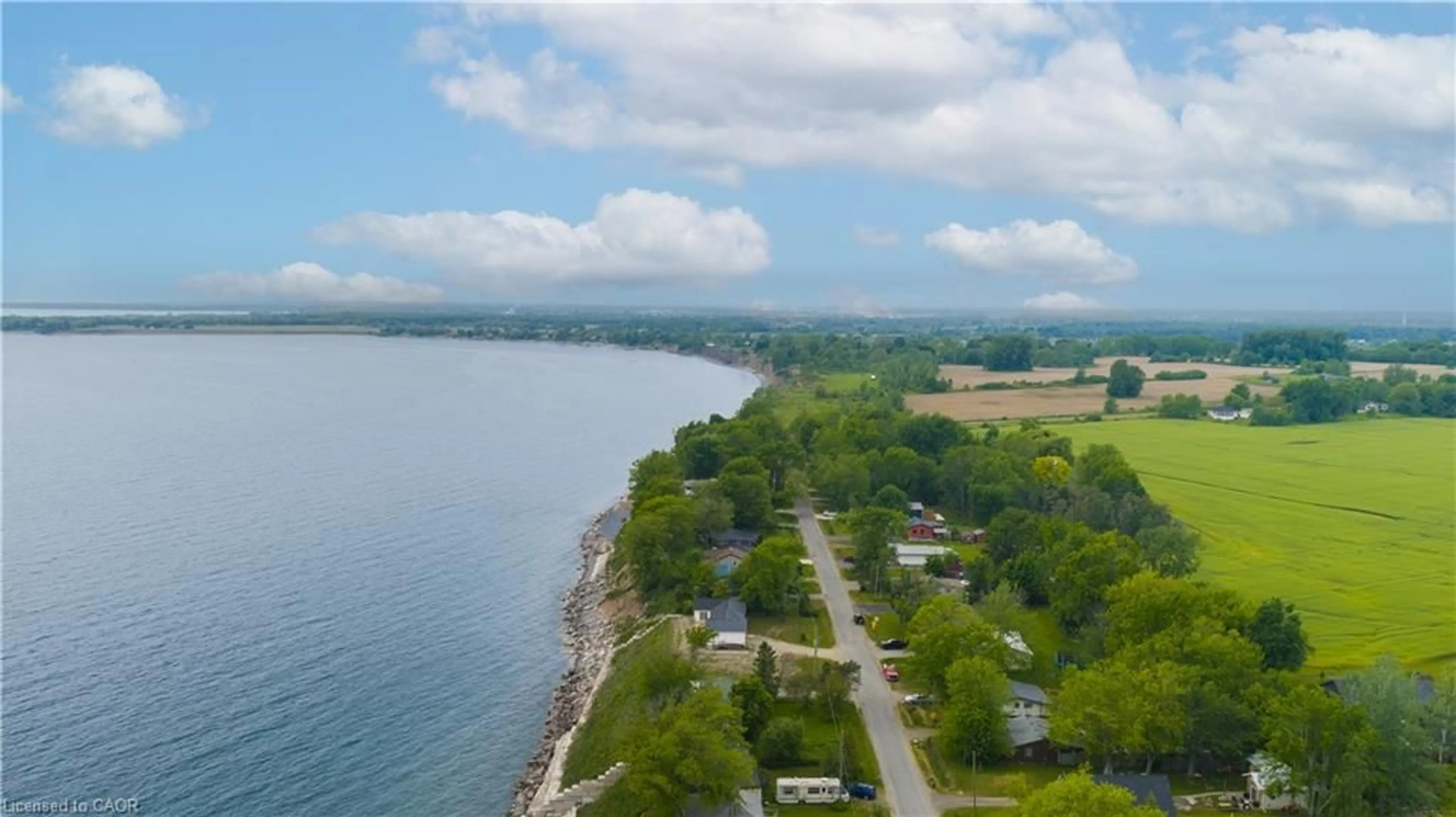 A pic from outside/outdoor area/front of a property/back of a property/a pic from drone, water/lake/river/ocean view for 21 Villella Rd, Lowbanks Ontario N0A 1K0