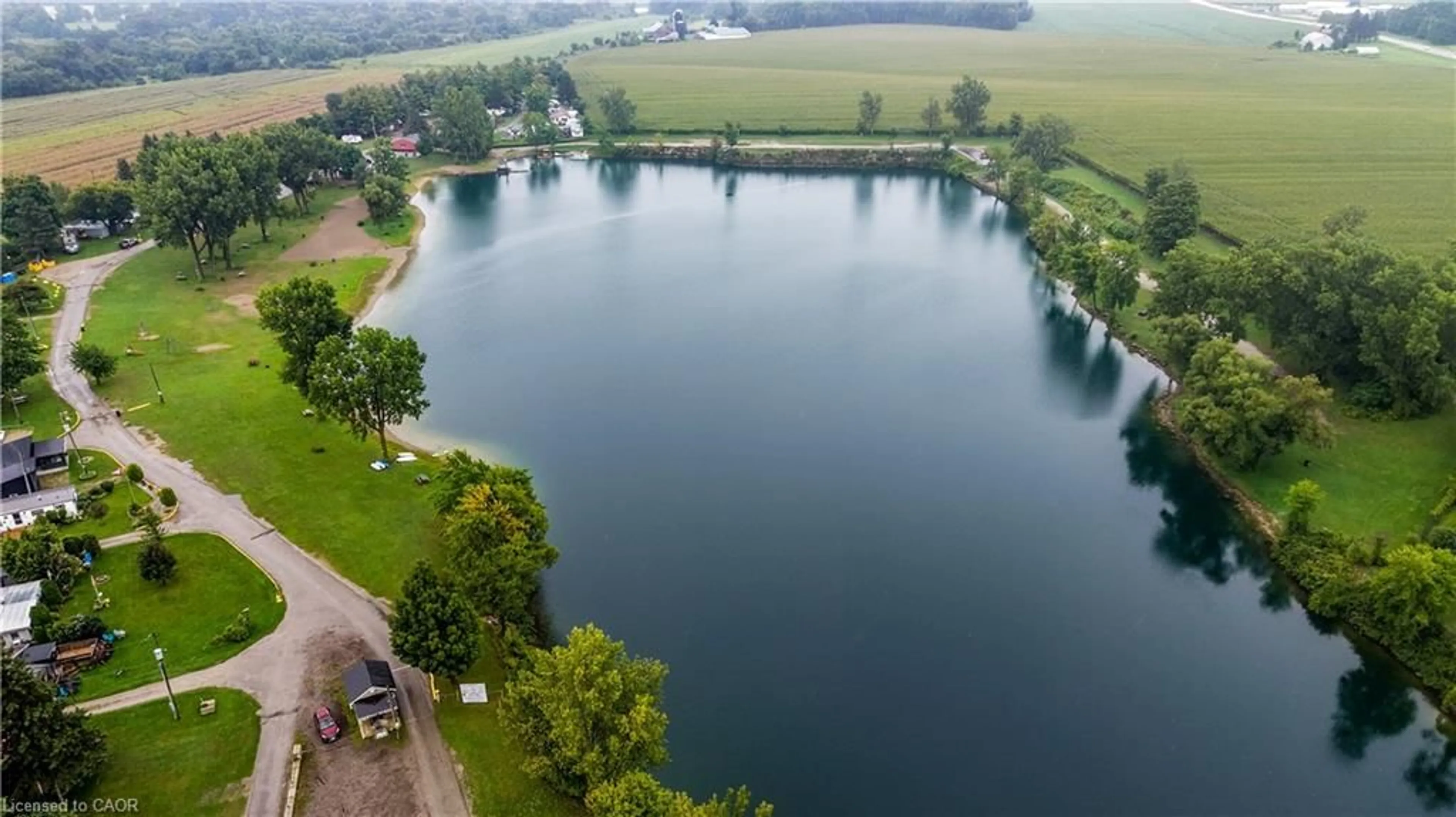 A pic from outside/outdoor area/front of a property/back of a property/a pic from drone, water/lake/river/ocean view for 44 Main St #19, Innerkip Ontario N0J 1M0