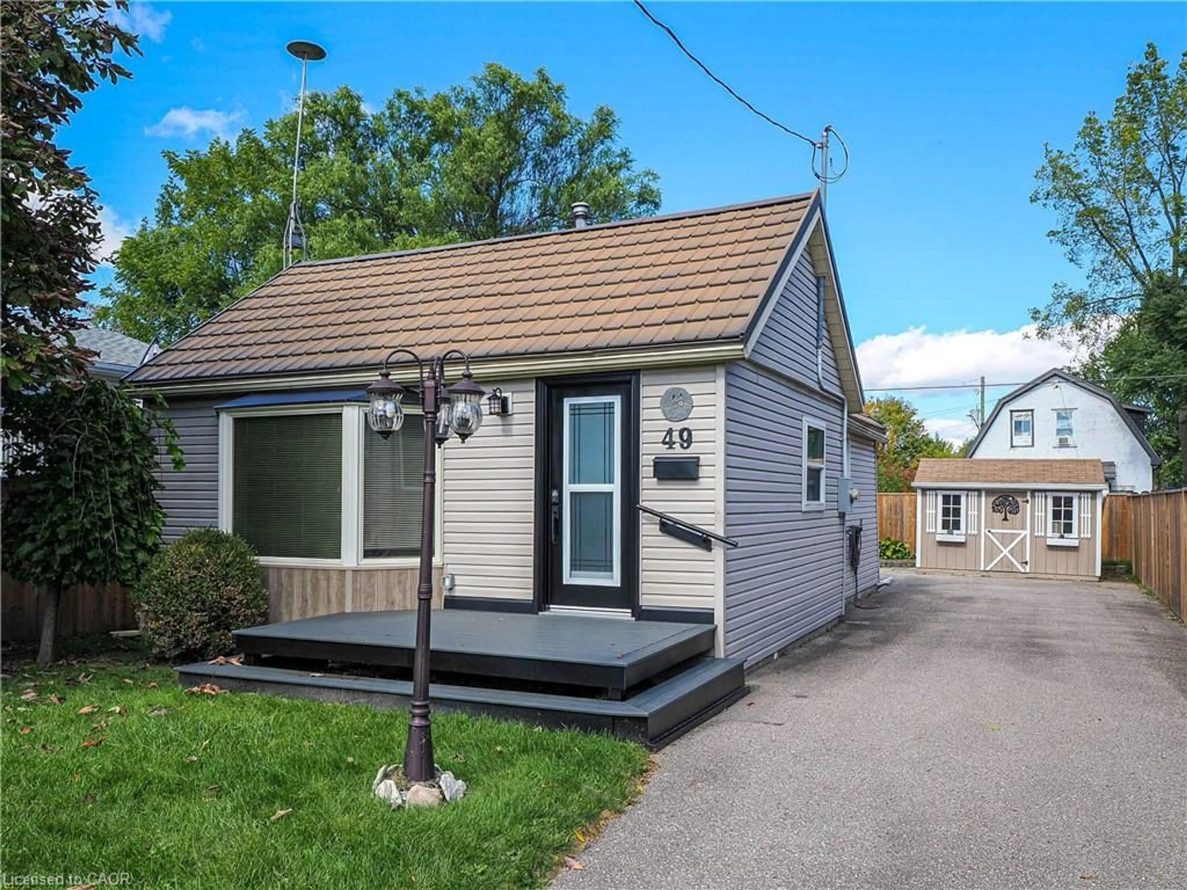 Home with vinyl exterior material, street for 49 Brown St, Port Dover Ontario N0A 1N7