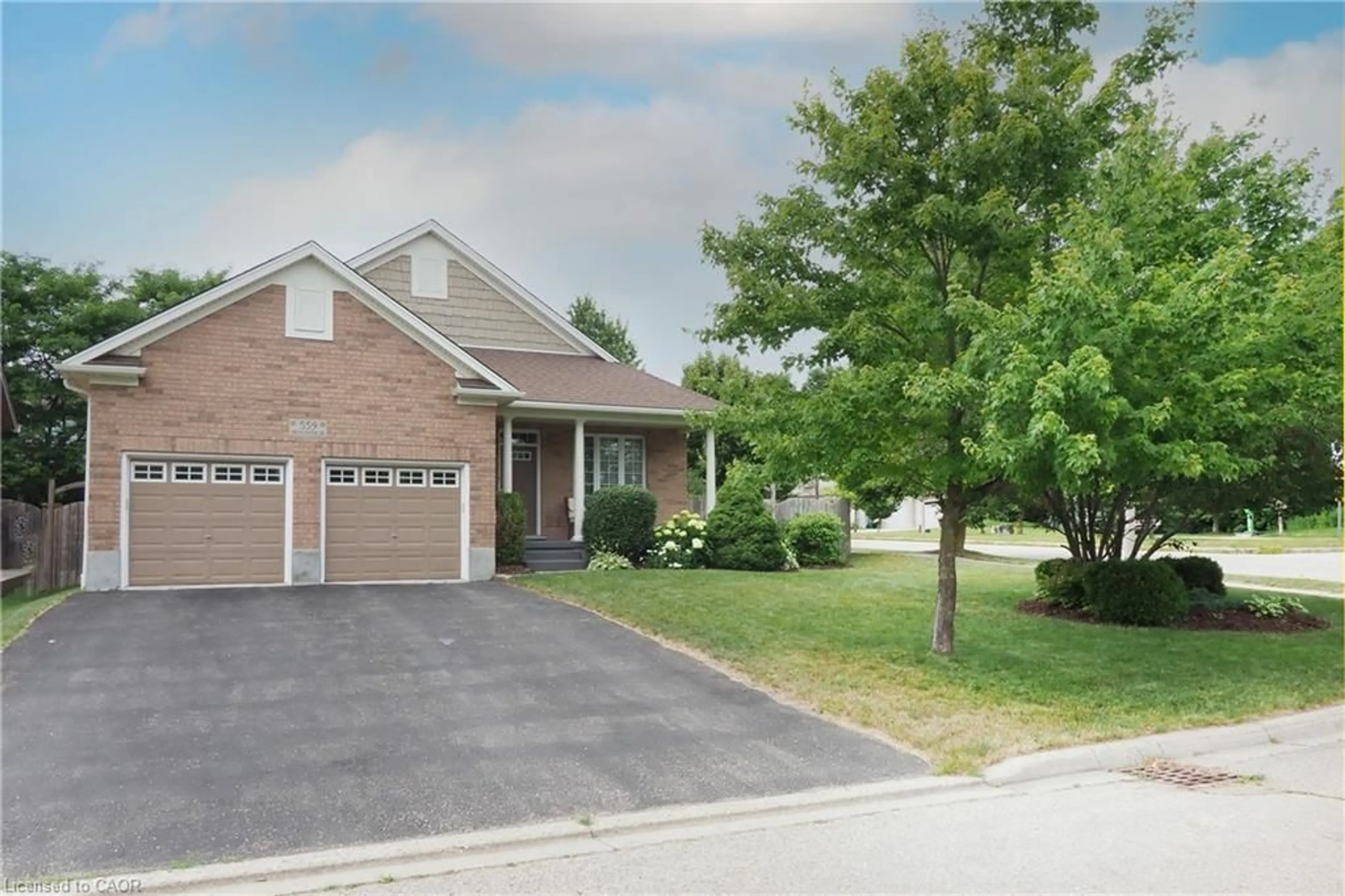 Home with brick exterior material, street for 559 Springwater Dr, Waterloo Ontario N2V 2K6