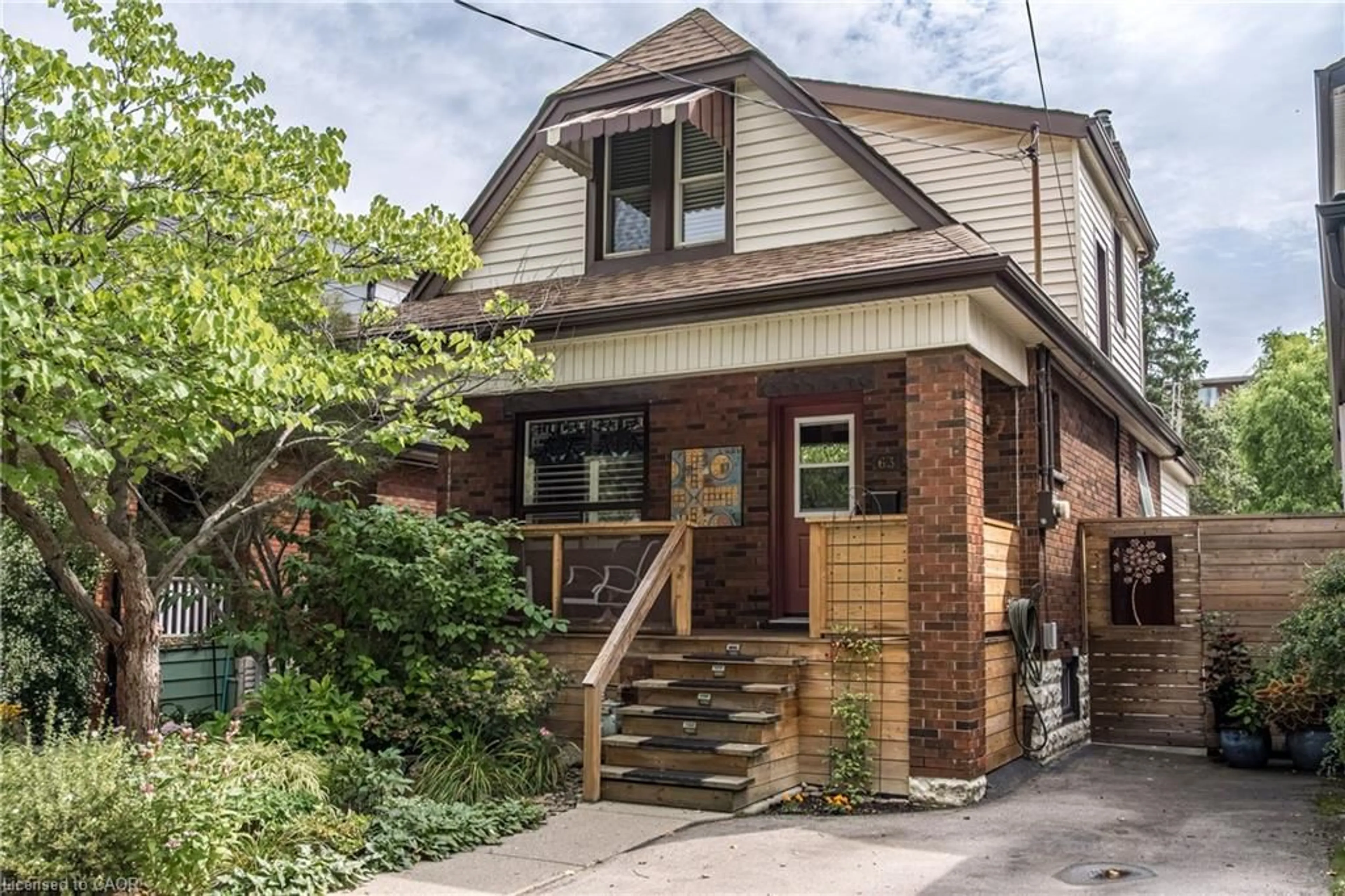 Home with brick exterior material, street for 63 Macdonald Ave, Hamilton Ontario L8P 4N8