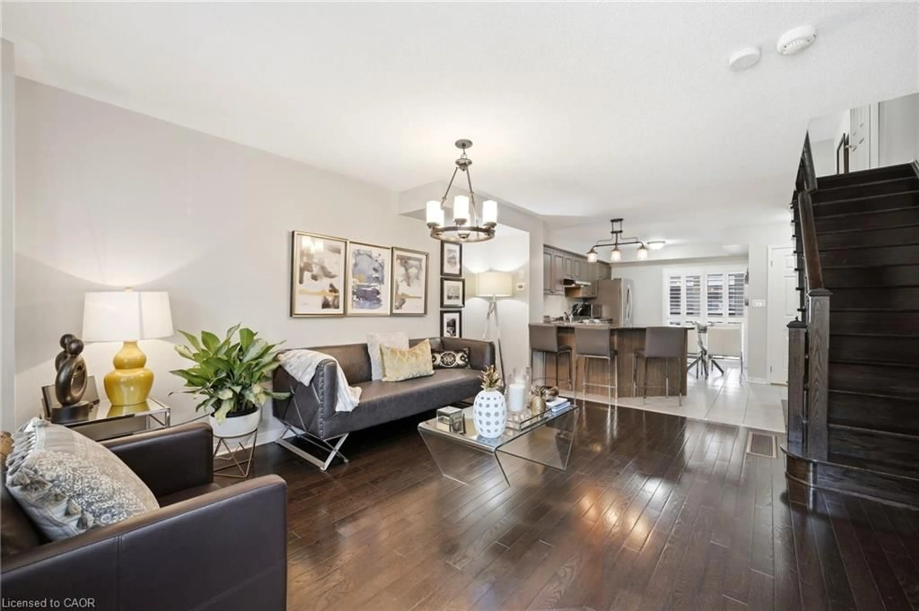 Living room with furniture, wood/laminate floor for 73 Ted Wray Cir, North York Ontario M3L 0G7