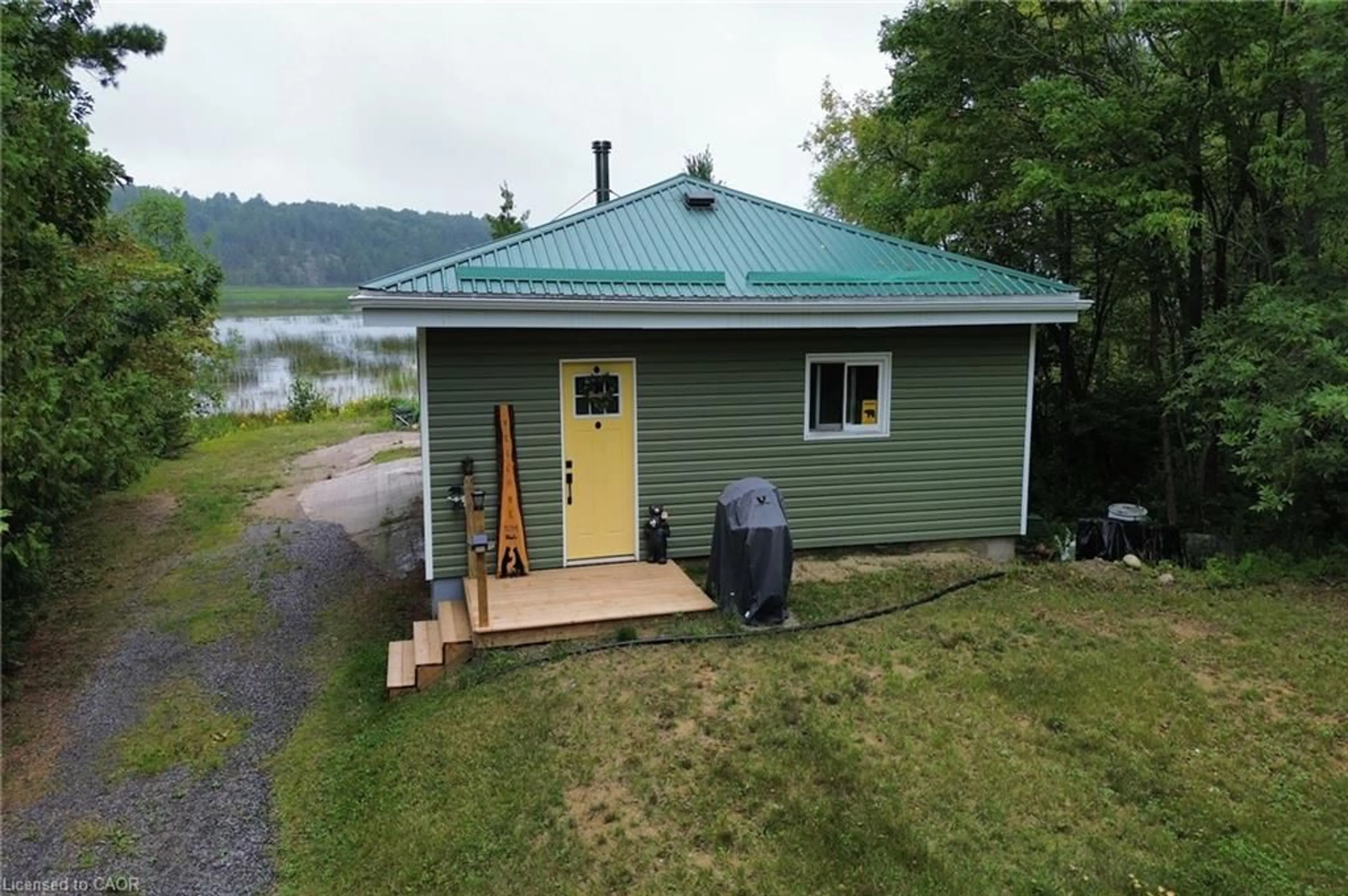 A pic from outside/outdoor area/front of a property/back of a property/a pic from drone, water/lake/river/ocean view for 354 Brennan Harbour Rd, Spanish Ontario P0P 2A0