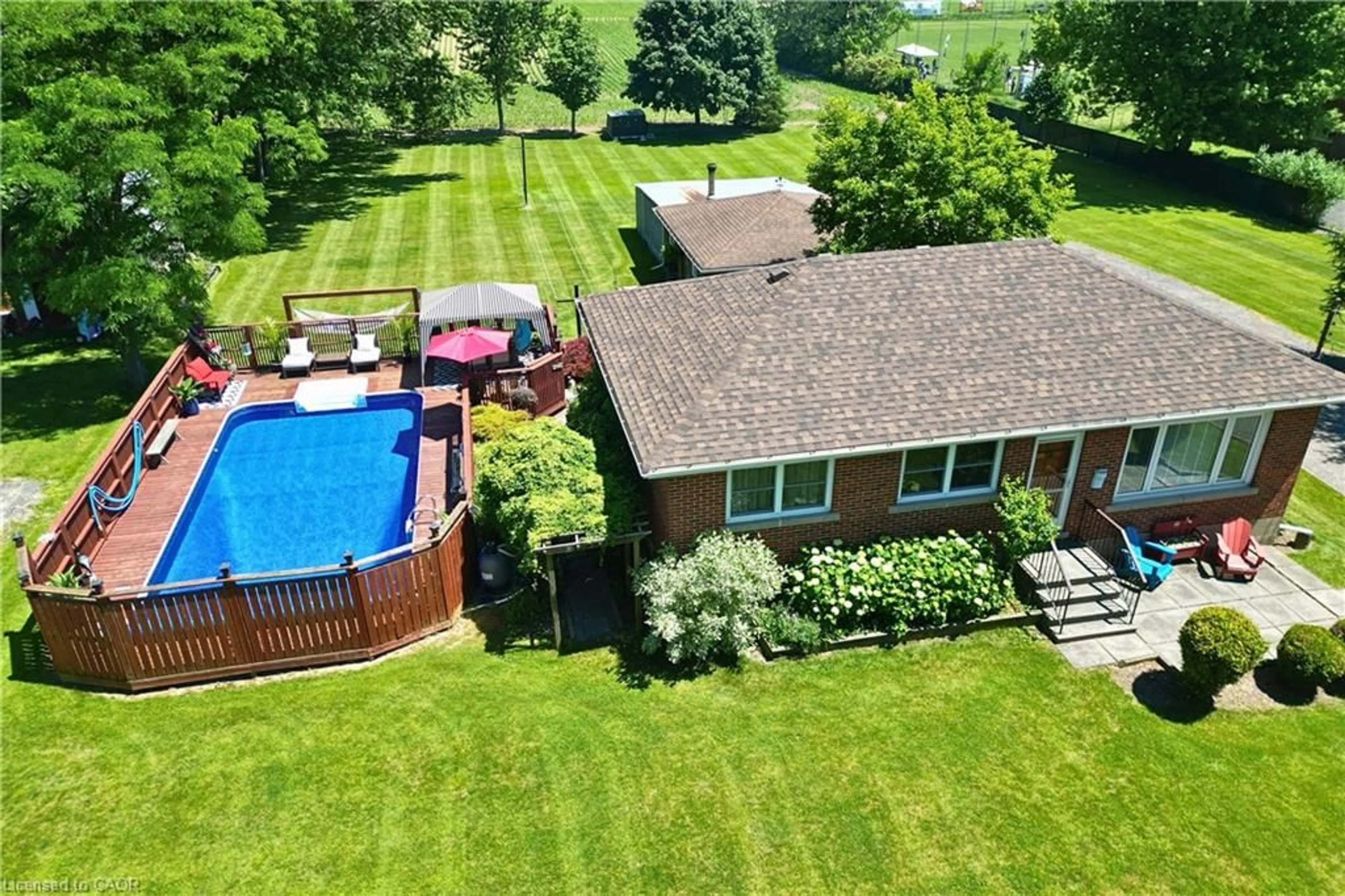 A pic from outside/outdoor area/front of a property/back of a property/a pic from drone, water/lake/river/ocean view for 1065 Woodburn Rd, Hannon Ontario L0R 1P0