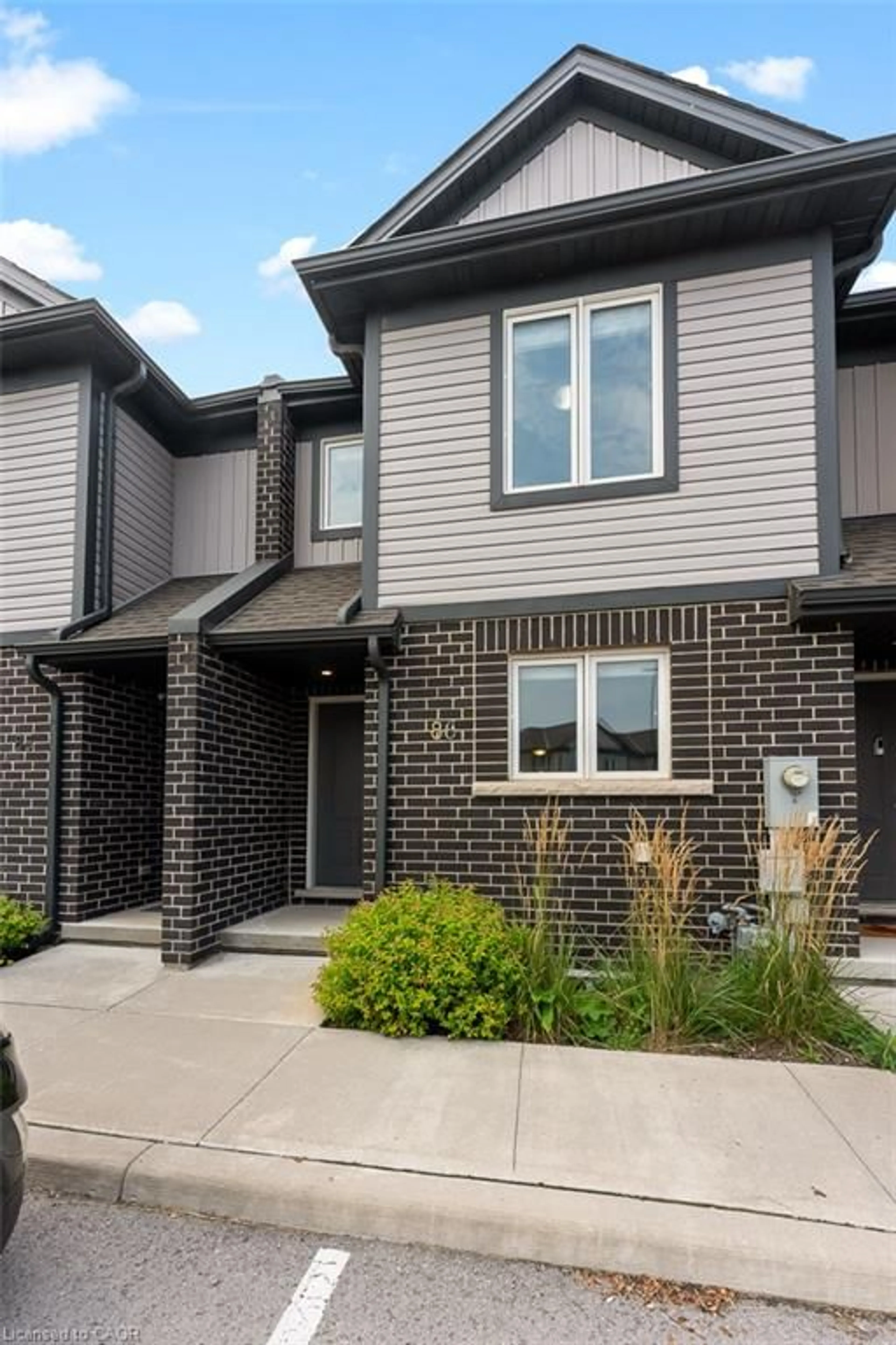 Home with brick exterior material, street for 7768 Ascot Cir #86, Niagara Falls Ontario L2H 3P9