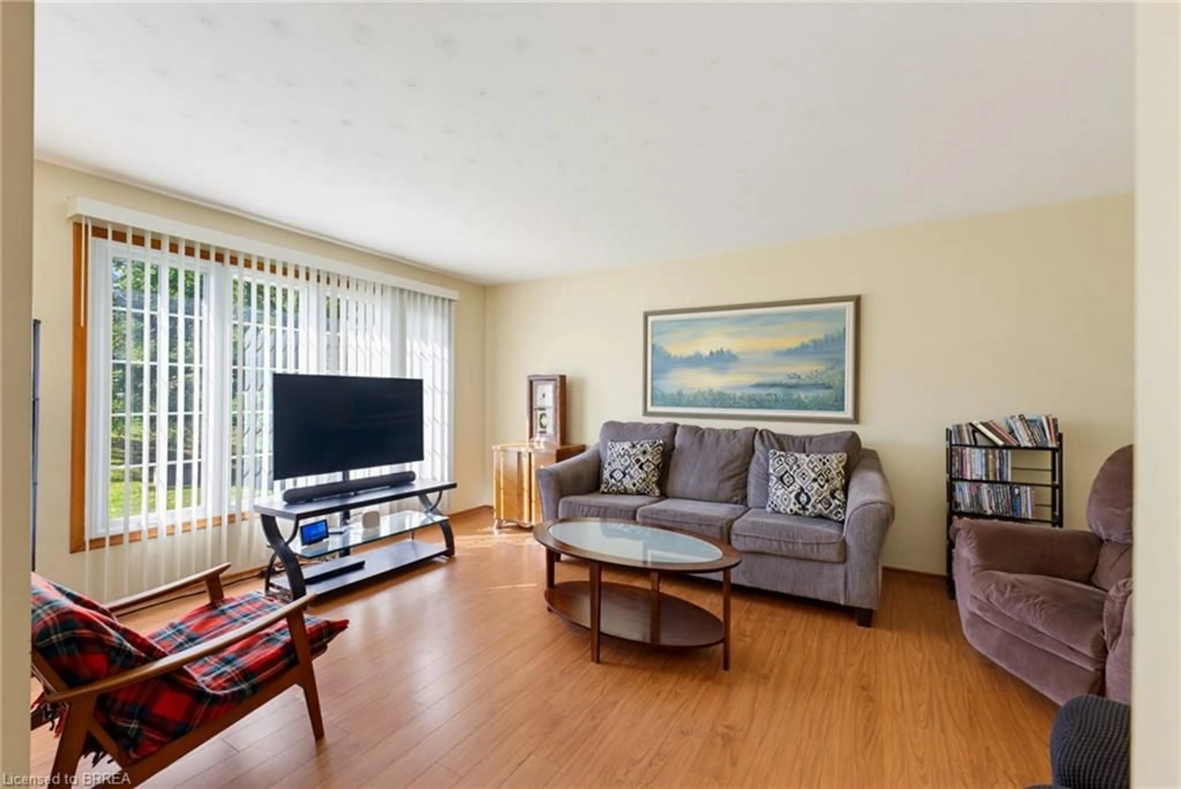 Living room with furniture, wood/laminate floor for 279 Highway 5, St. George Ontario N0E 1N0