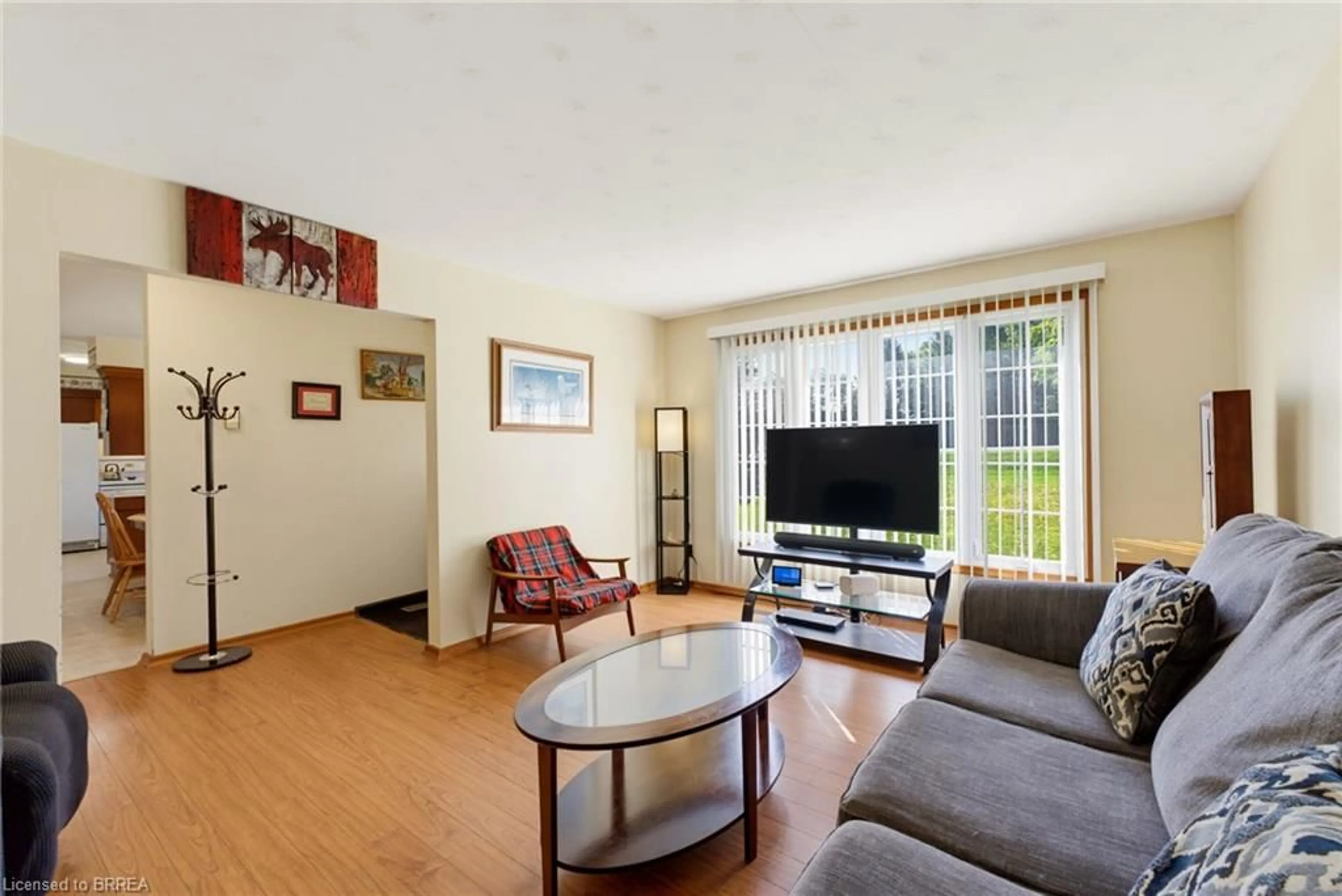 Living room with furniture, wood/laminate floor for 279 Highway 5, St. George Ontario N0E 1N0