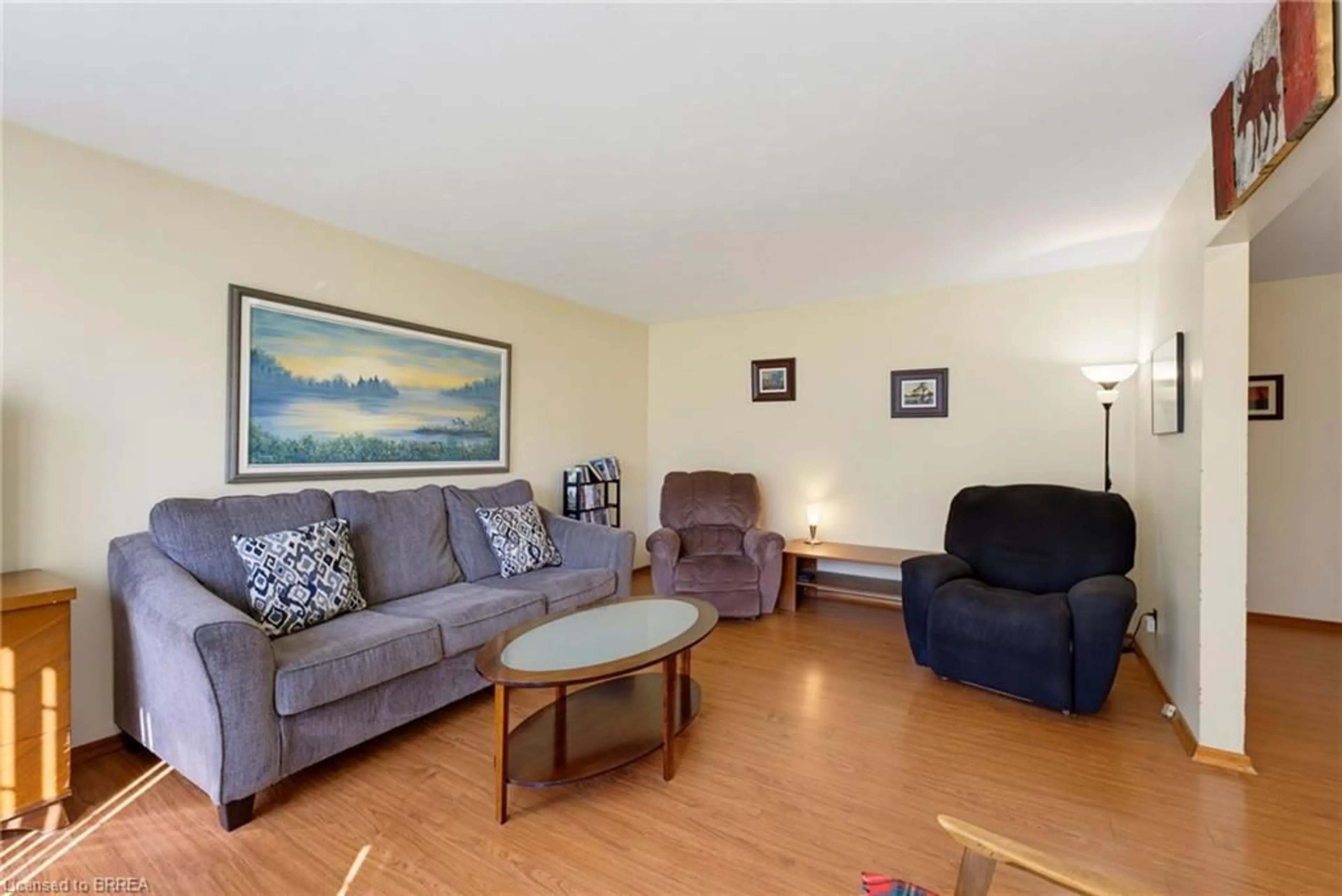Living room with furniture, wood/laminate floor for 279 Highway 5, St. George Ontario N0E 1N0